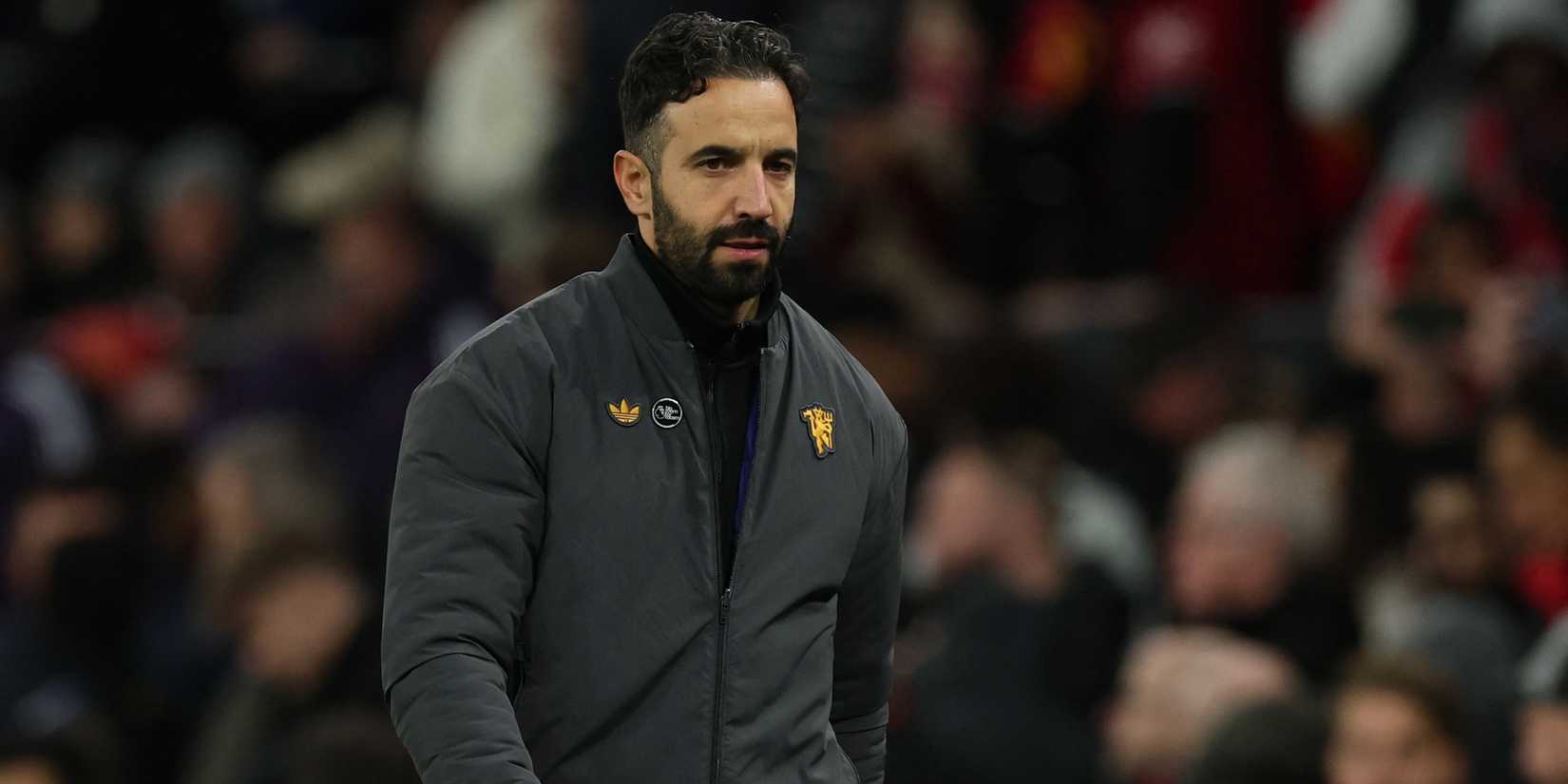 Manchester United manager Ruben Amorim walks off for half time