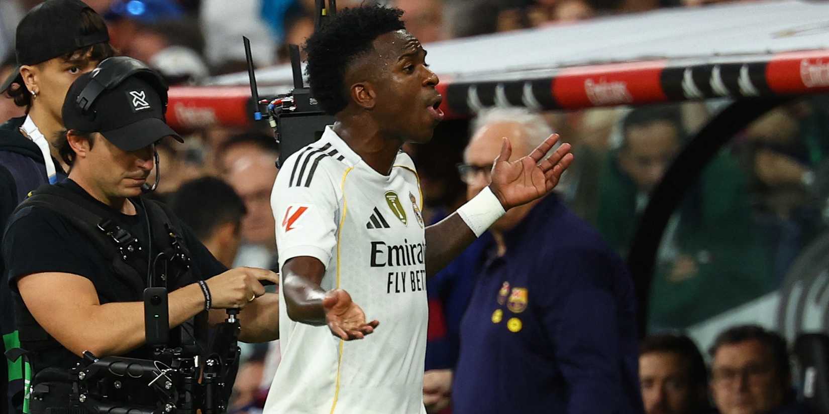 Real Madrid's Vinicius Junior reacts after being sent off