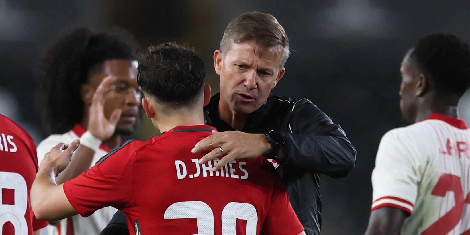 Wales' Daniel James embraces Canada coach Jesse Marsch