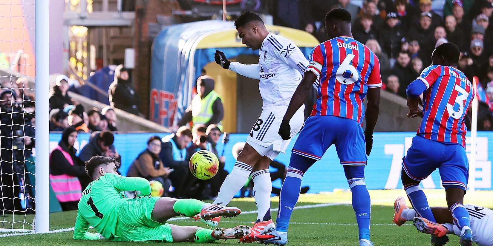 Crystal Palace's Dean Henderson saves from Manchester United's Casemiro