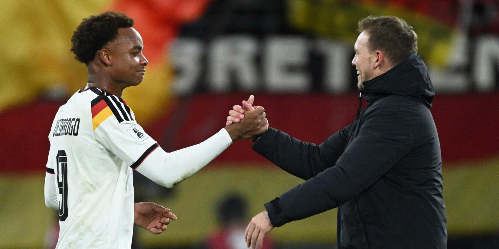 Germany's Assan Ouedraogo shakes hands with coach Julian Nagelsmann after the match