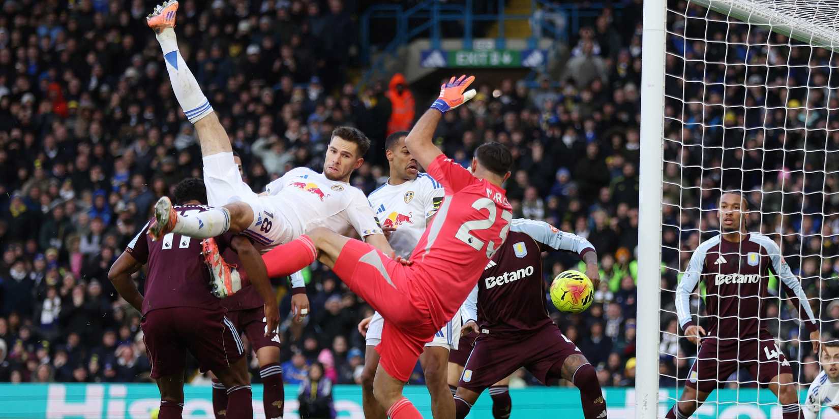 Leeds United's Anton Stach in action with Aston Villa's Emiliano Martinez