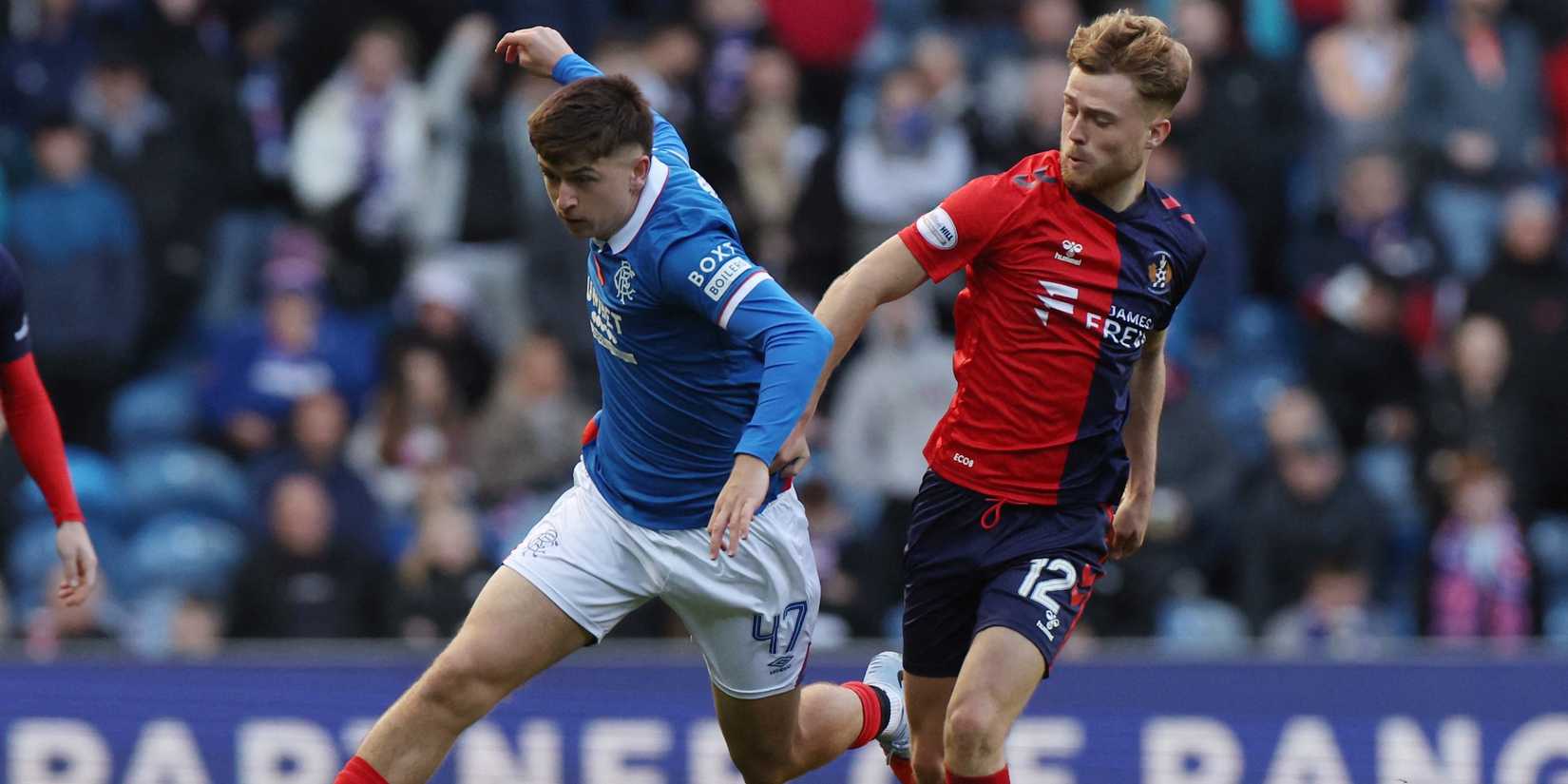 Rangers' Mikey Moore in action with Kilmarnock's David Watson