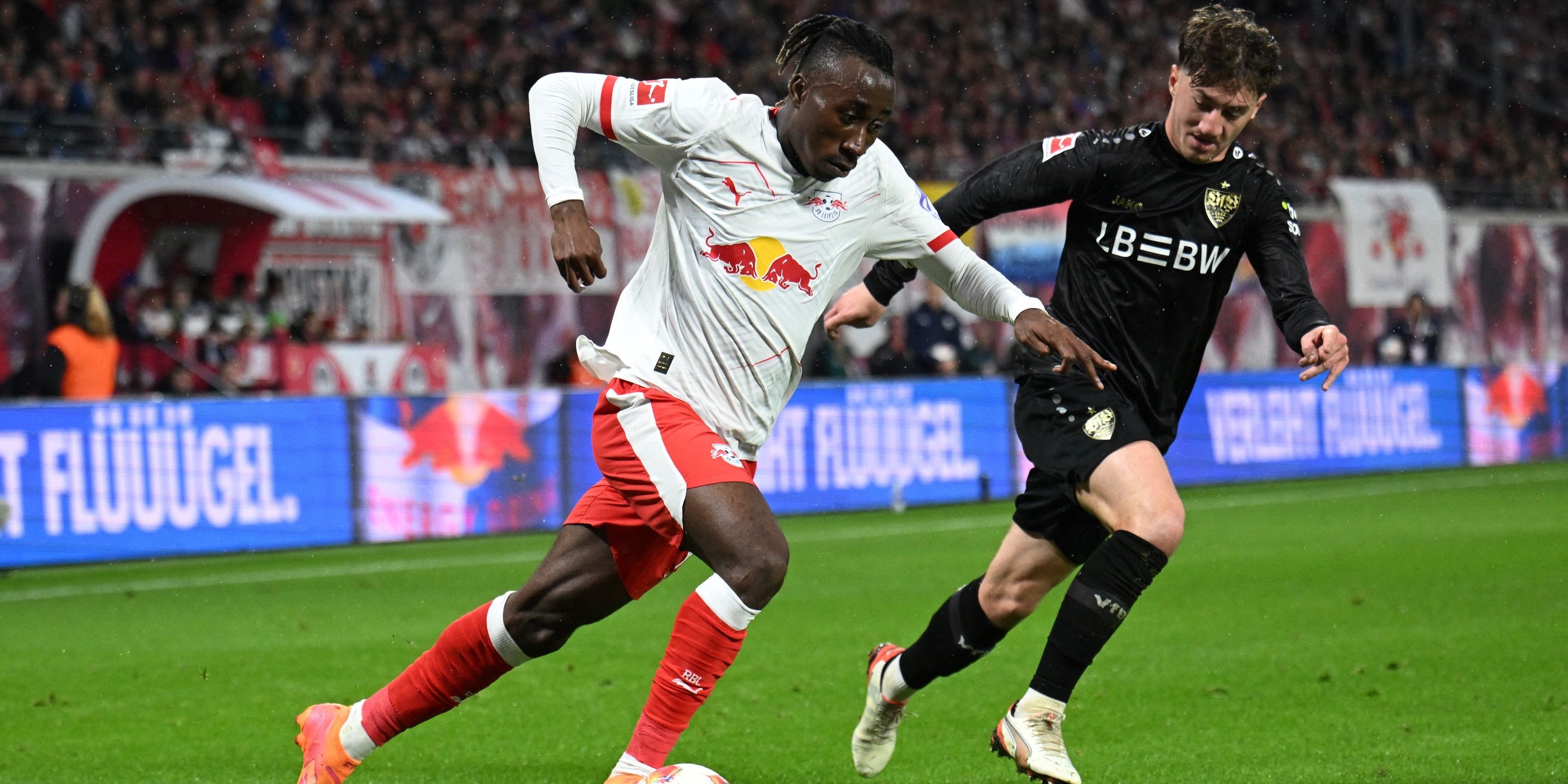 RB Leipzig's Yan Diomande in action with VfB Stuttgart's Angelo Stiller