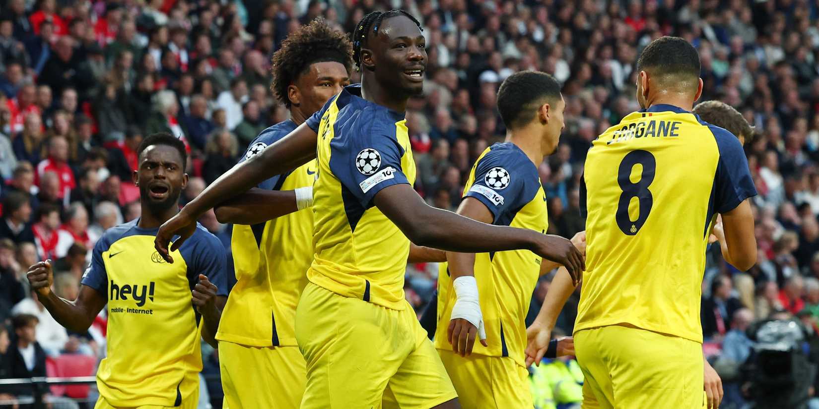 Union Saint-Gilloise's Promise David celebrates with teammates after scoring their first goal