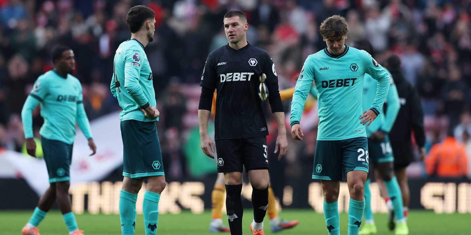 Wolverhampton Wanderers' Sam Johnstone and Fer Lopez look dejected after the match