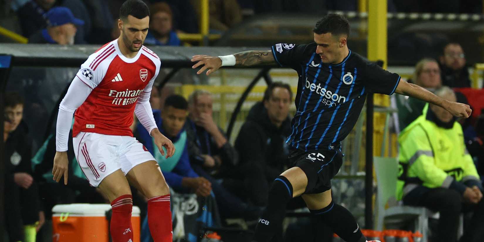 Club Brugge's Aleksandar Stankovic in action with Arsenal's Mikel Merino