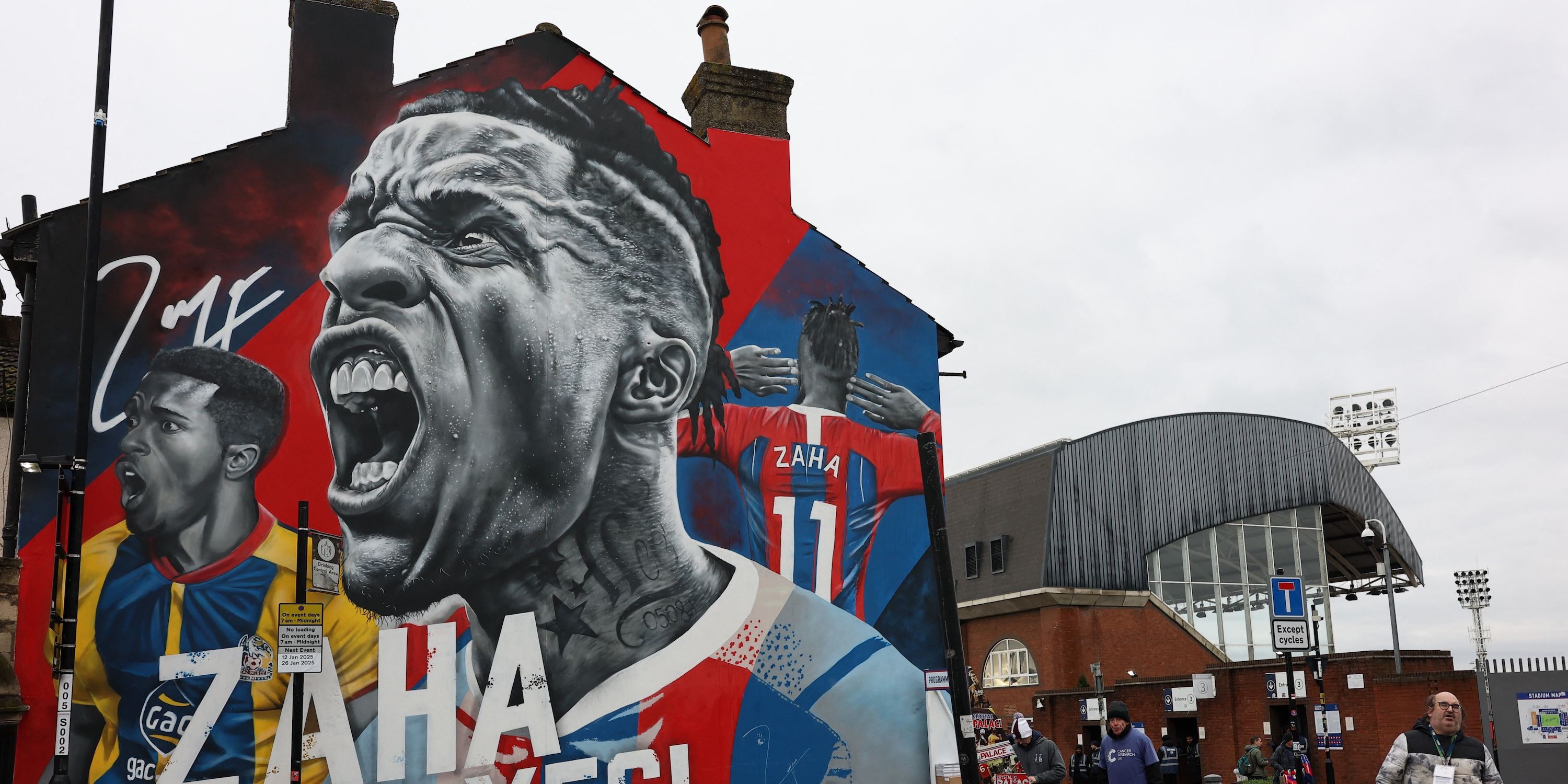General view of a mural of former Crystal Palace player Wilfried Zaha outside the stadium