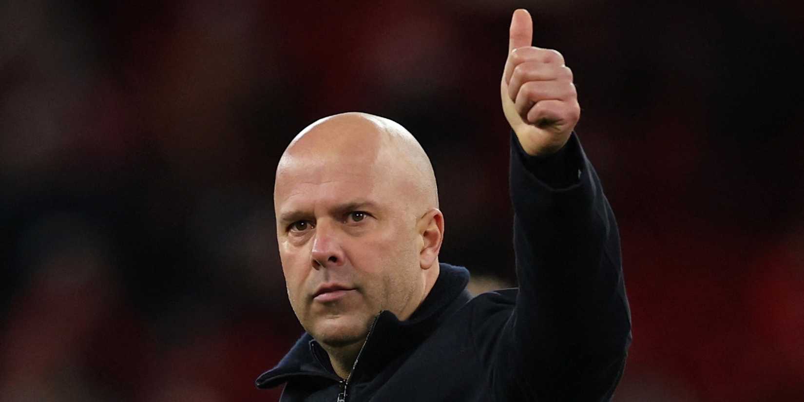 Liverpool manager Arne Slott celebrates after the game