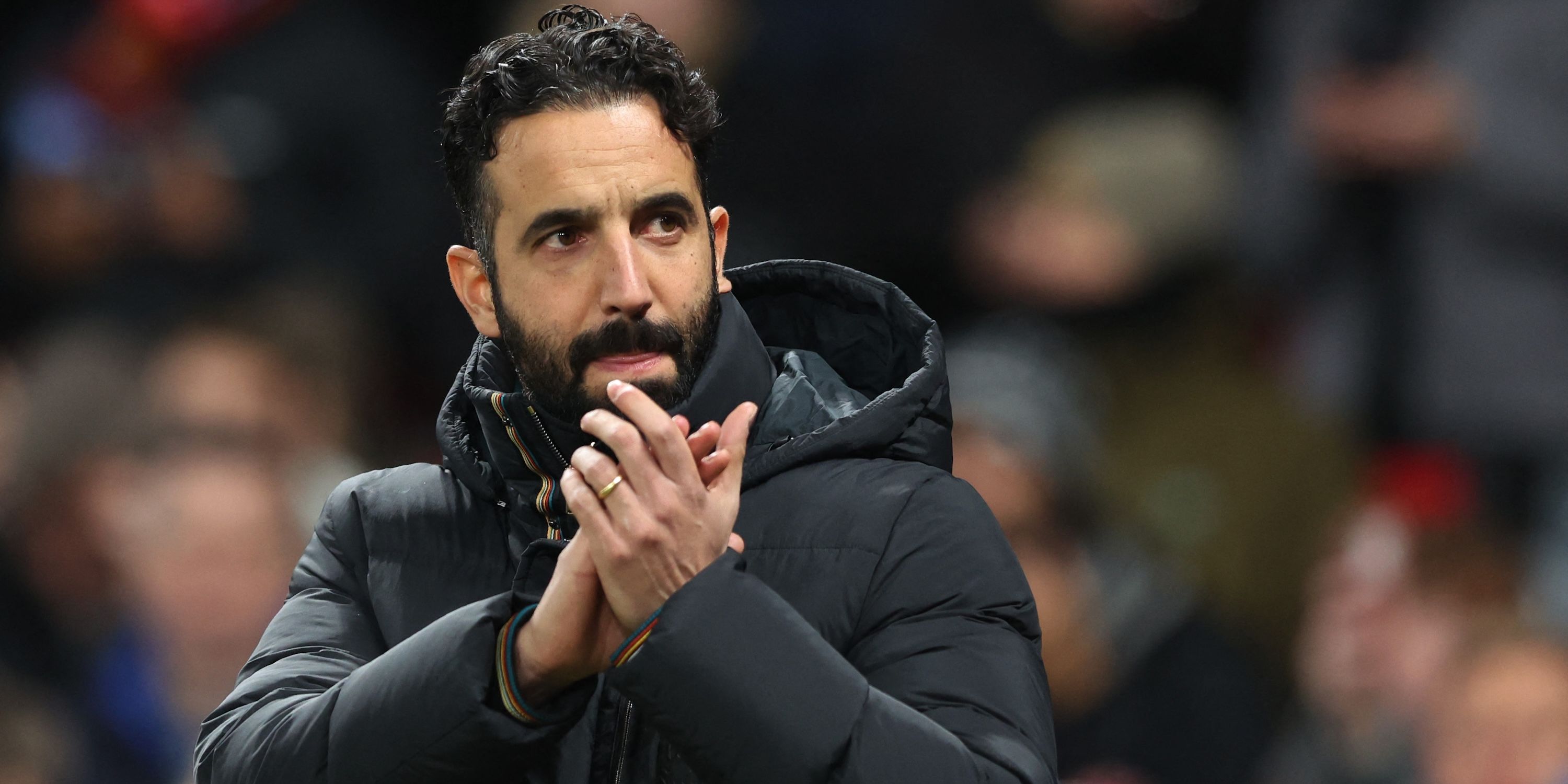 Manchester United manager Ruben Amorim applauds fans before the match