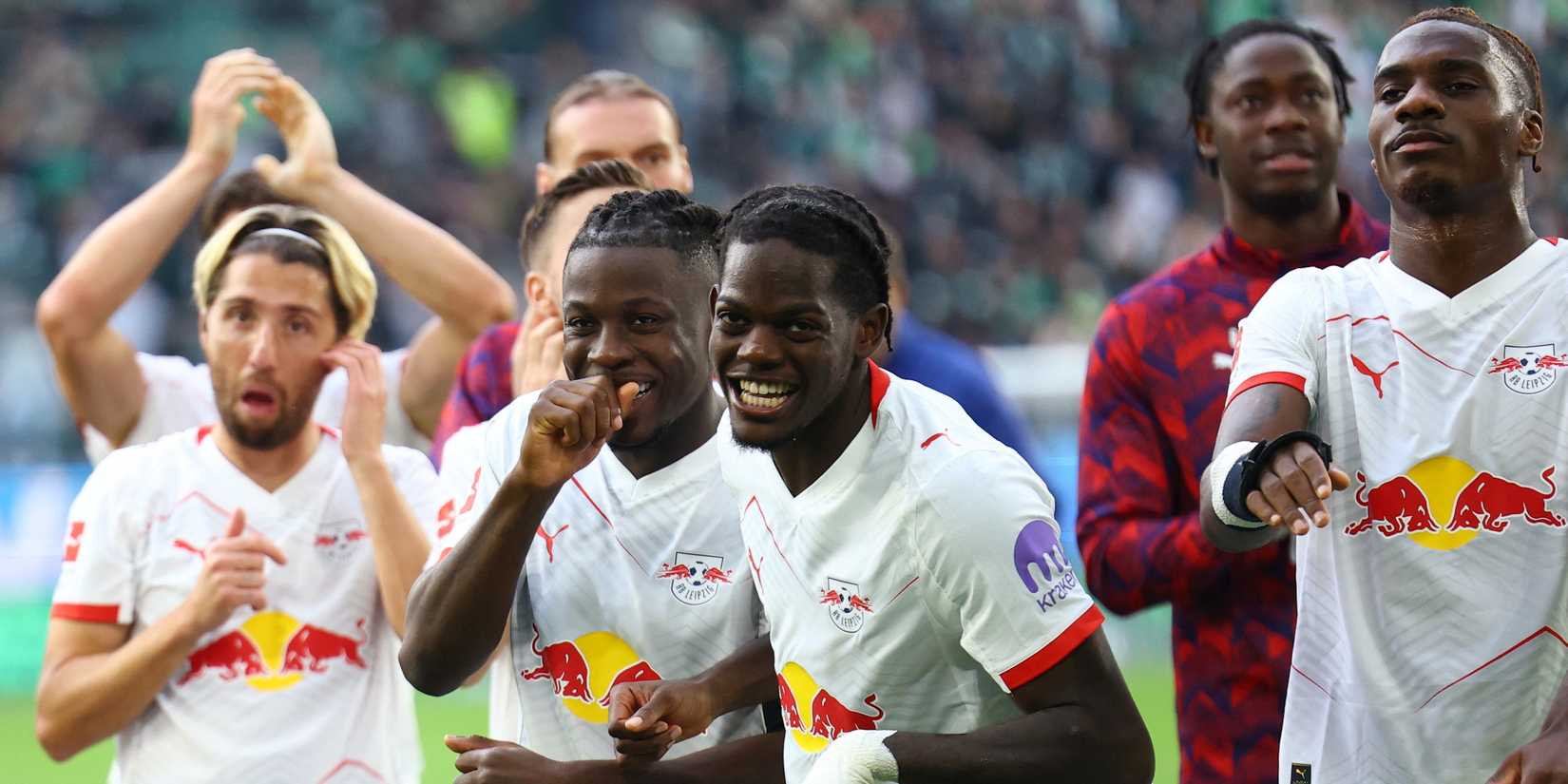 RB Leipzig's Castello Lukeba and Johan Bakayoko celebrate after the match