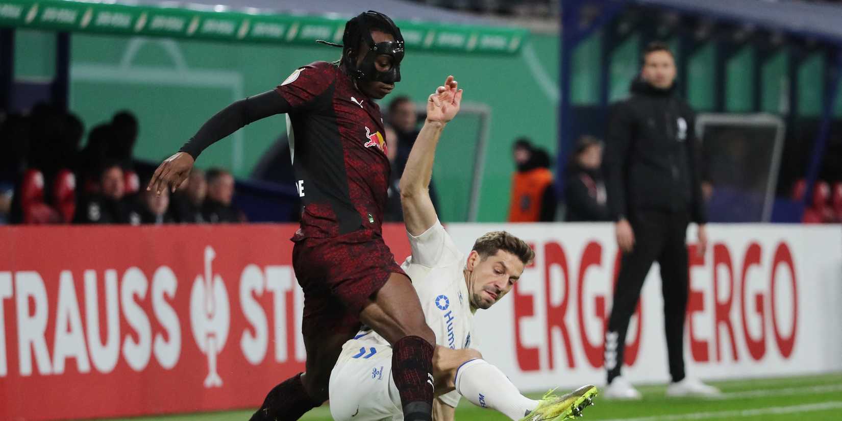 Yan Diomande of RB Leipzig in action with Alexander Nollenberger of 1. FC Magdeburg 