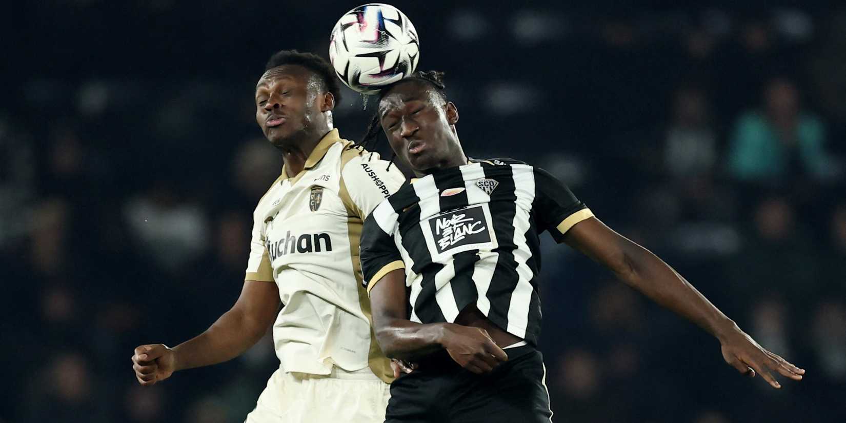     RC Lens' Samson Baidoo plays with Angers SCO's Sidiki Cherif