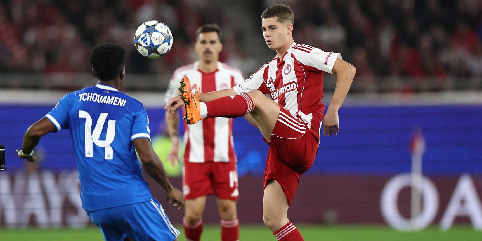 Real Madrid's Aurelien Tchouameni in action with Olympiacos' Christos Mouzakitis 