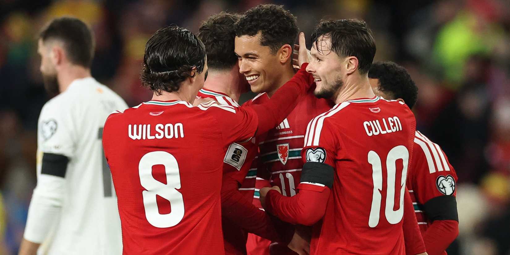  Wales' Brennan Johnson celebrates scoring their third goal with Harry Wilson and Liam Cullen