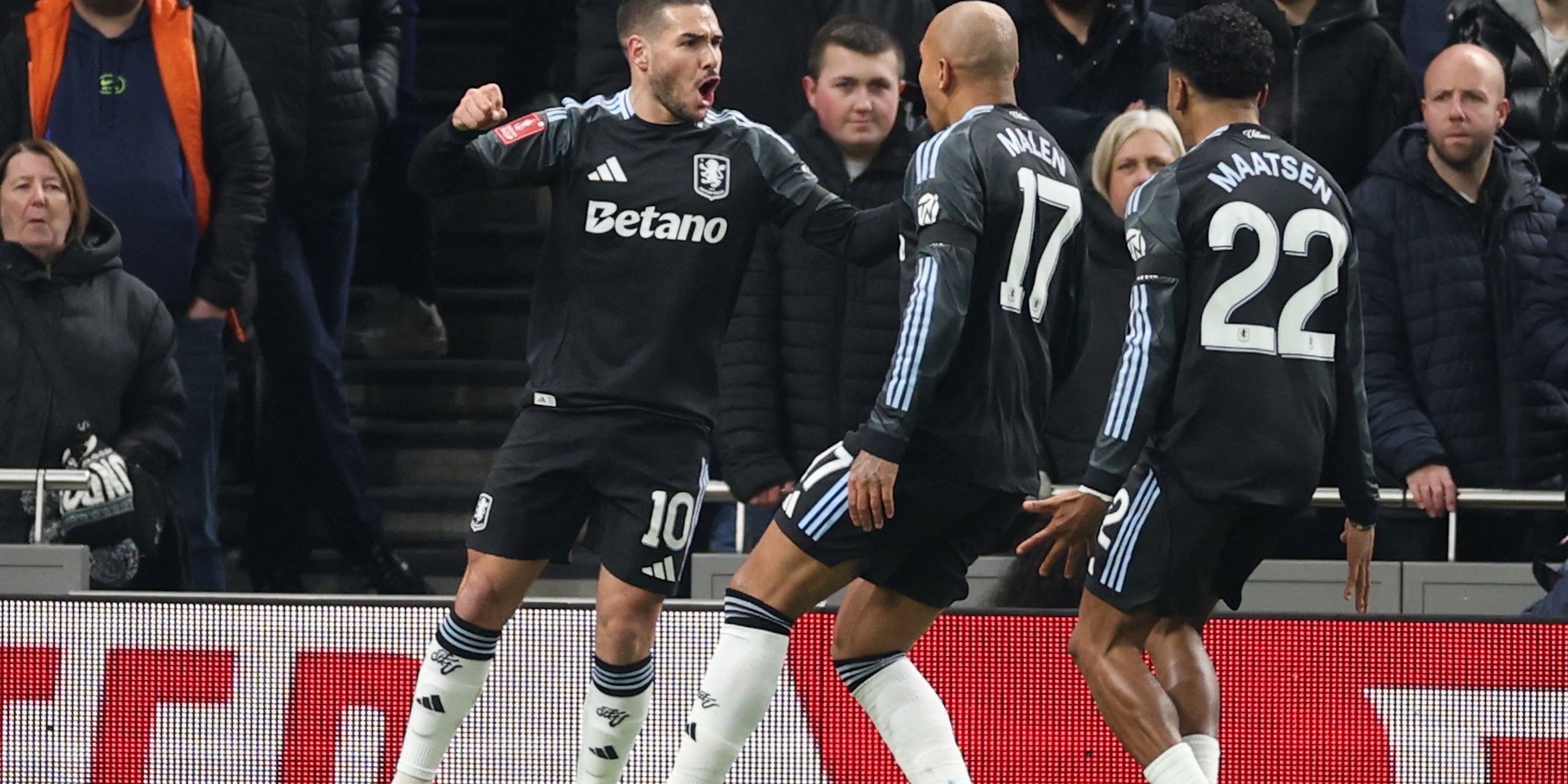 Aston Villa's Emiliano Buendia celebrates scoring their first goal with Donyell Malen and Ian Maatsen 