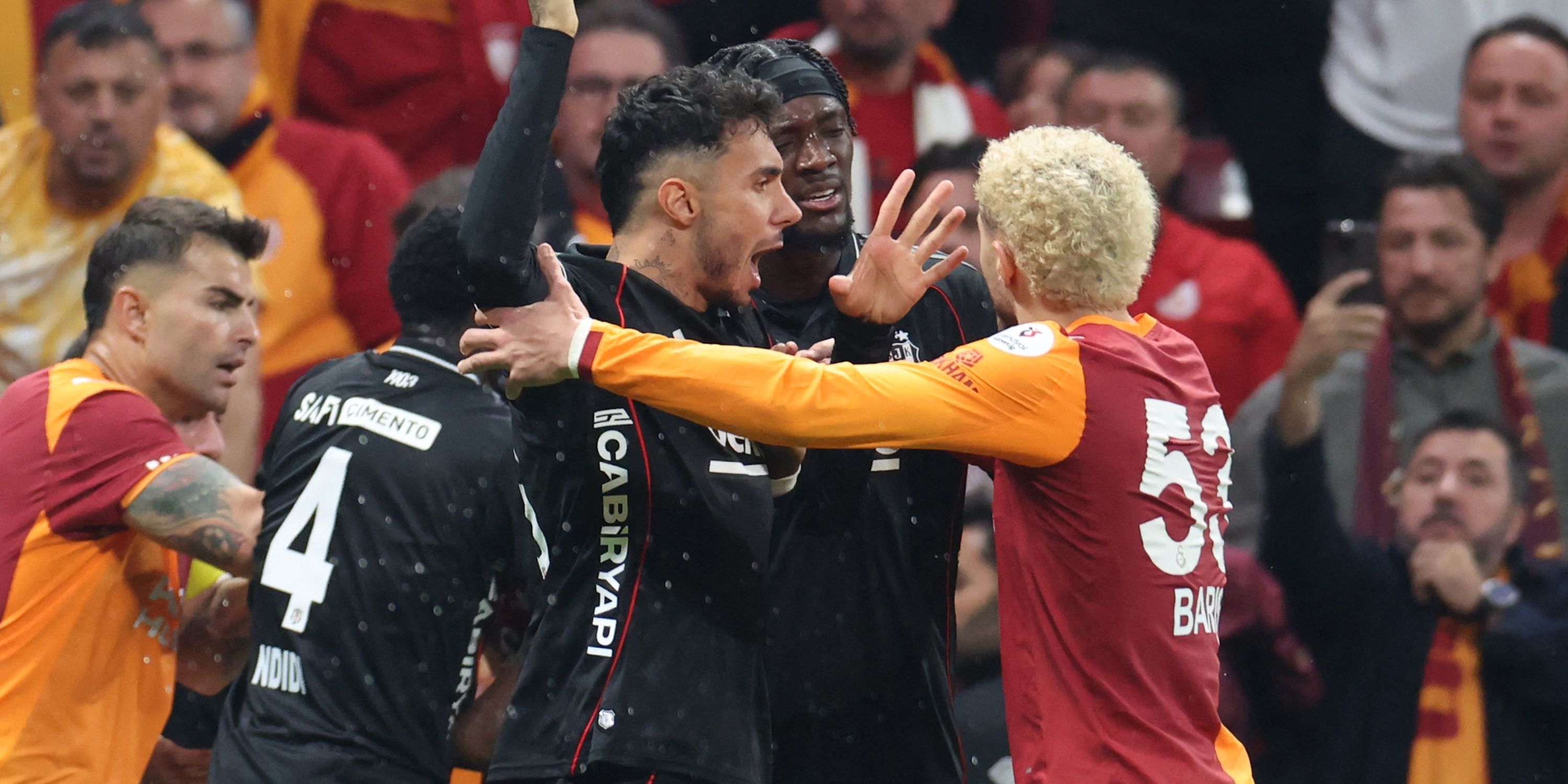 Besiktas's Tammy Abraham and Galatasaray's Baris Alper Yilmaz clash