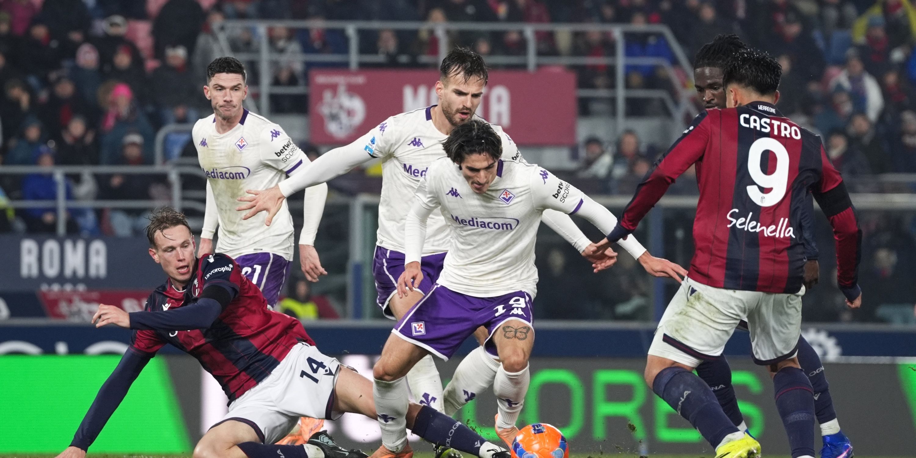 Bologna's Torbjörn Hegem competes with Fiorentina's Niccolò Fortini for the ball 