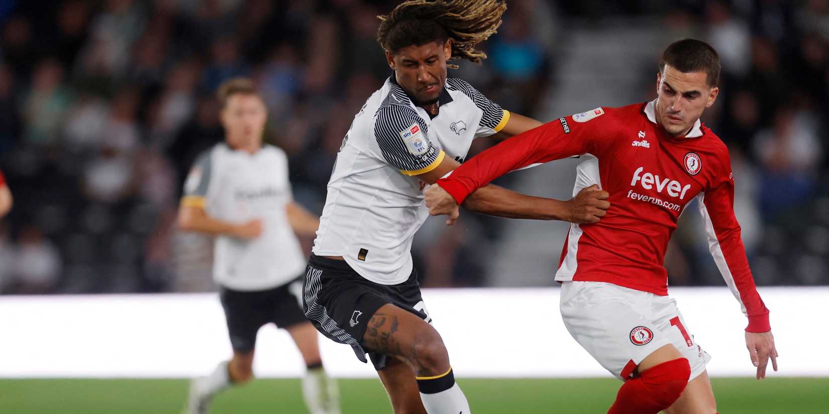 Bristol City's Anis Mehmeti in action with Derby County's Dion Sanderson