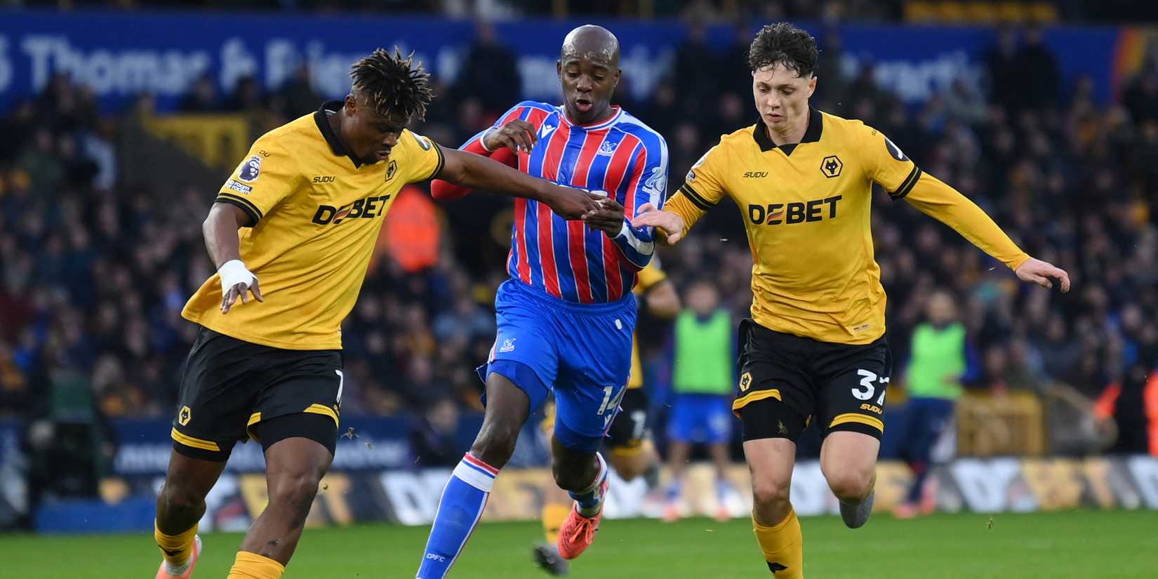 Crystal Palace's Jean-Philippe Mateta in action with Wolverhampton Wanderers' Ladislav Krejci and Emmanuel Agbadou