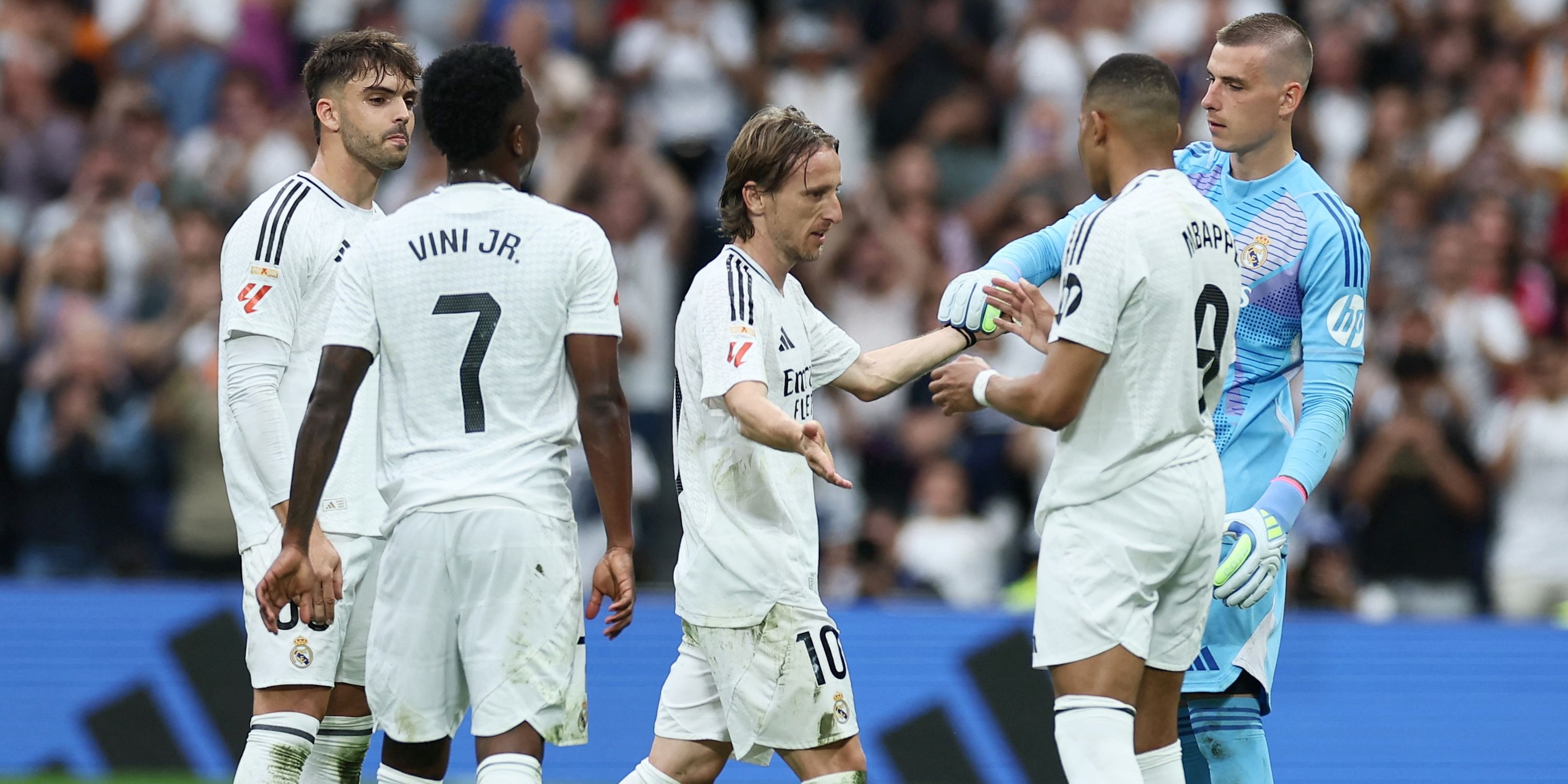 Real Madrid's Luka Modric with Real Madrid's Raul Asencio, Real Madrid's Andriy Lunin, Real Madrid's Kylian Mbappe and Real Madrid's Vinicius Junior as he walks off the pitch