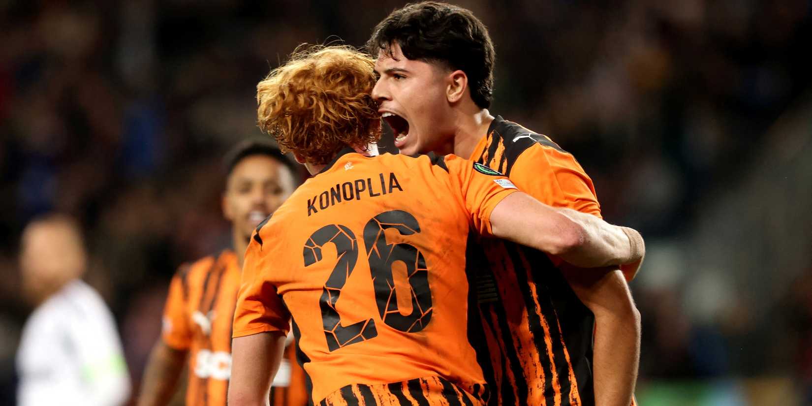 Shakhtar Donetsk's Luca Meirelles celebrates scoring their first goal with Yukhym Konoplya