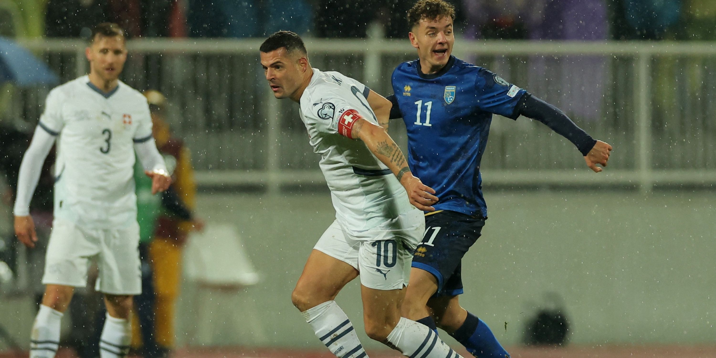 Switzerland's Granit Xhaka in action with Kosovo's Fisnik Asllani 