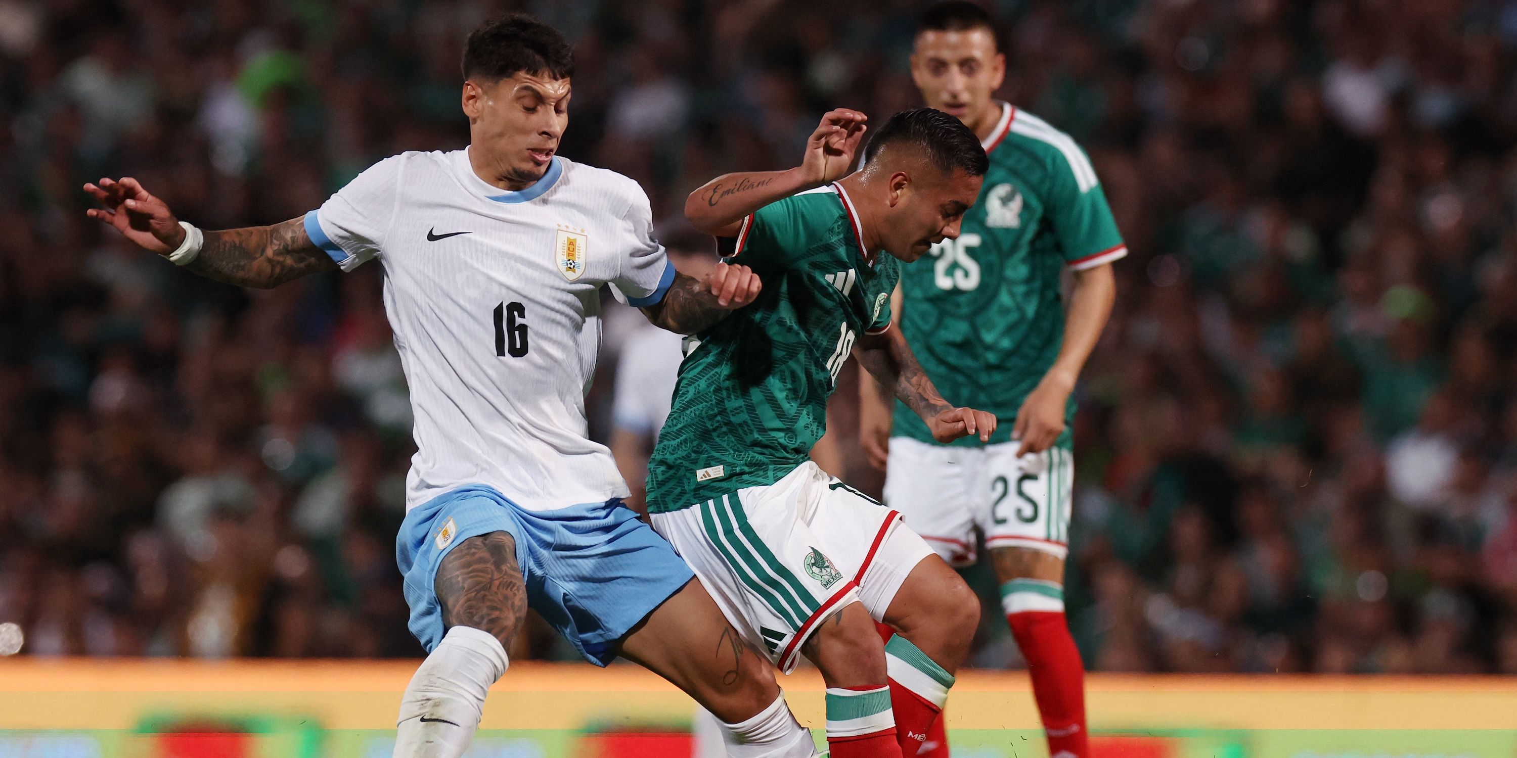 Uruguay's Mathias Olivera in action with Mexico's Erick Sanchez