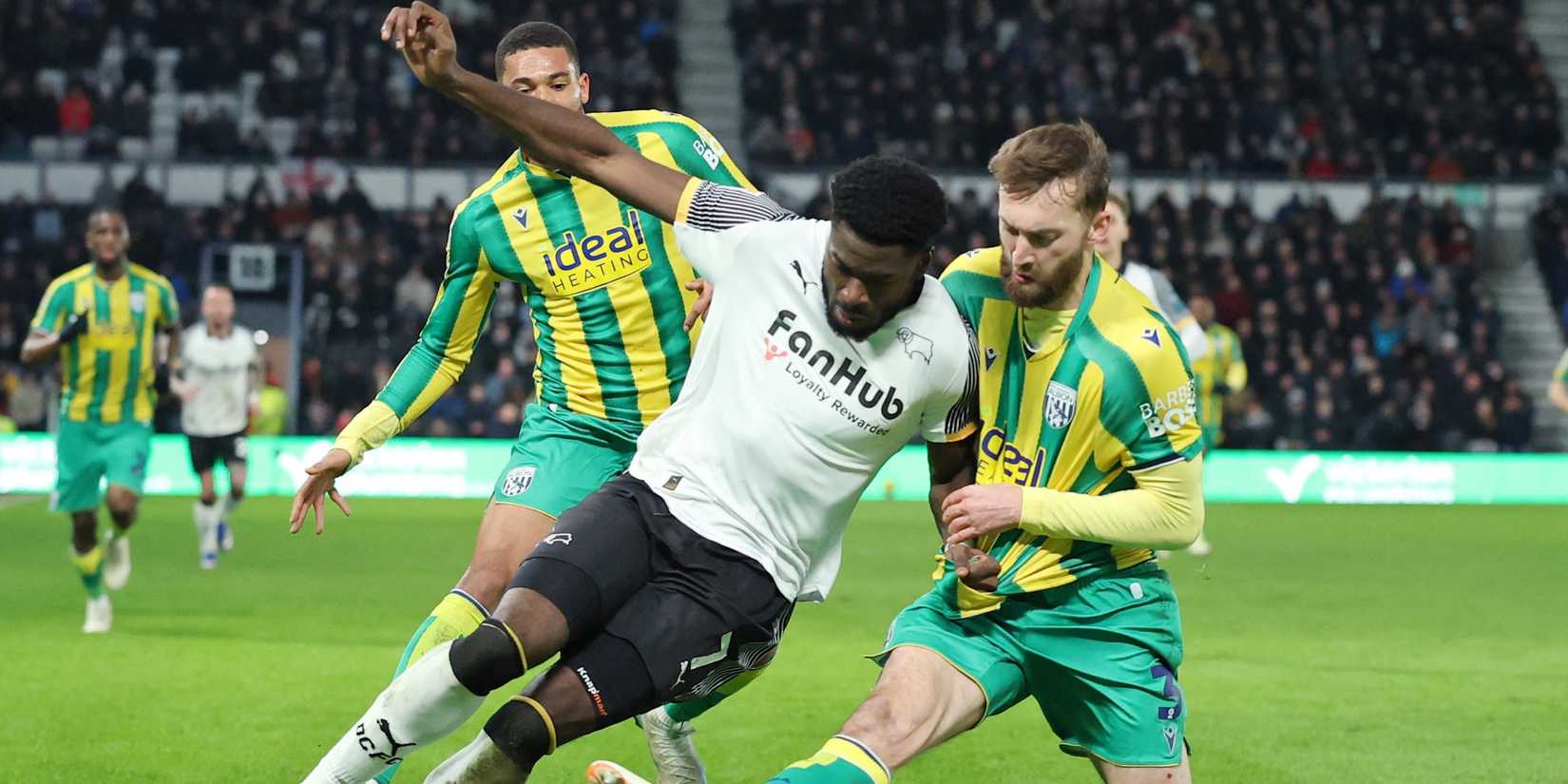 Derby County's Patrick Agyemang in action with West Bromwich Albion's Nathaniel Phillips