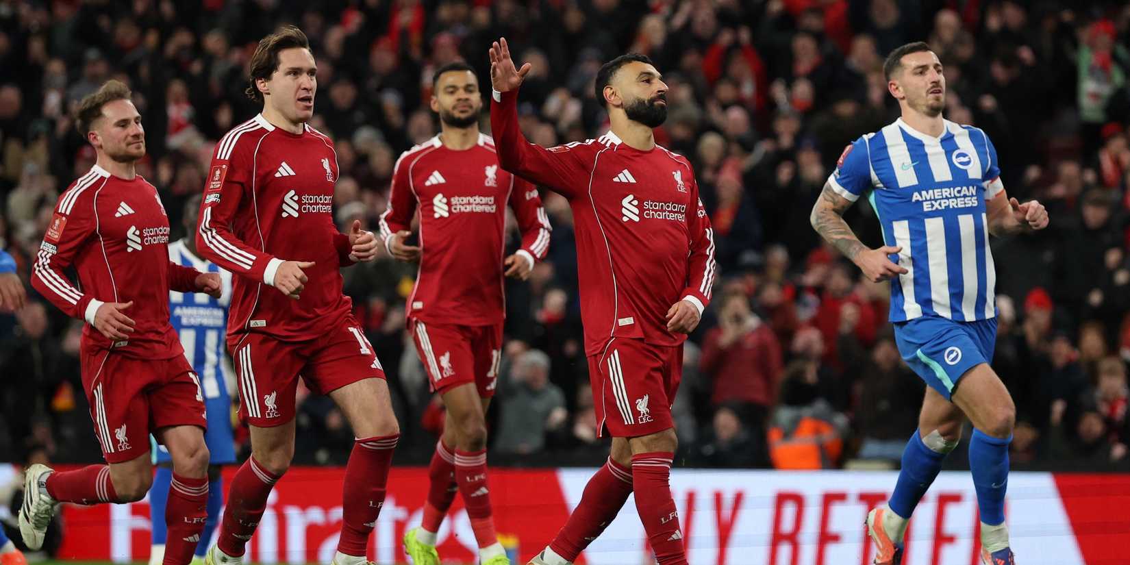 Mohamed Salah dari Liverpool merayakan gol ketiganya