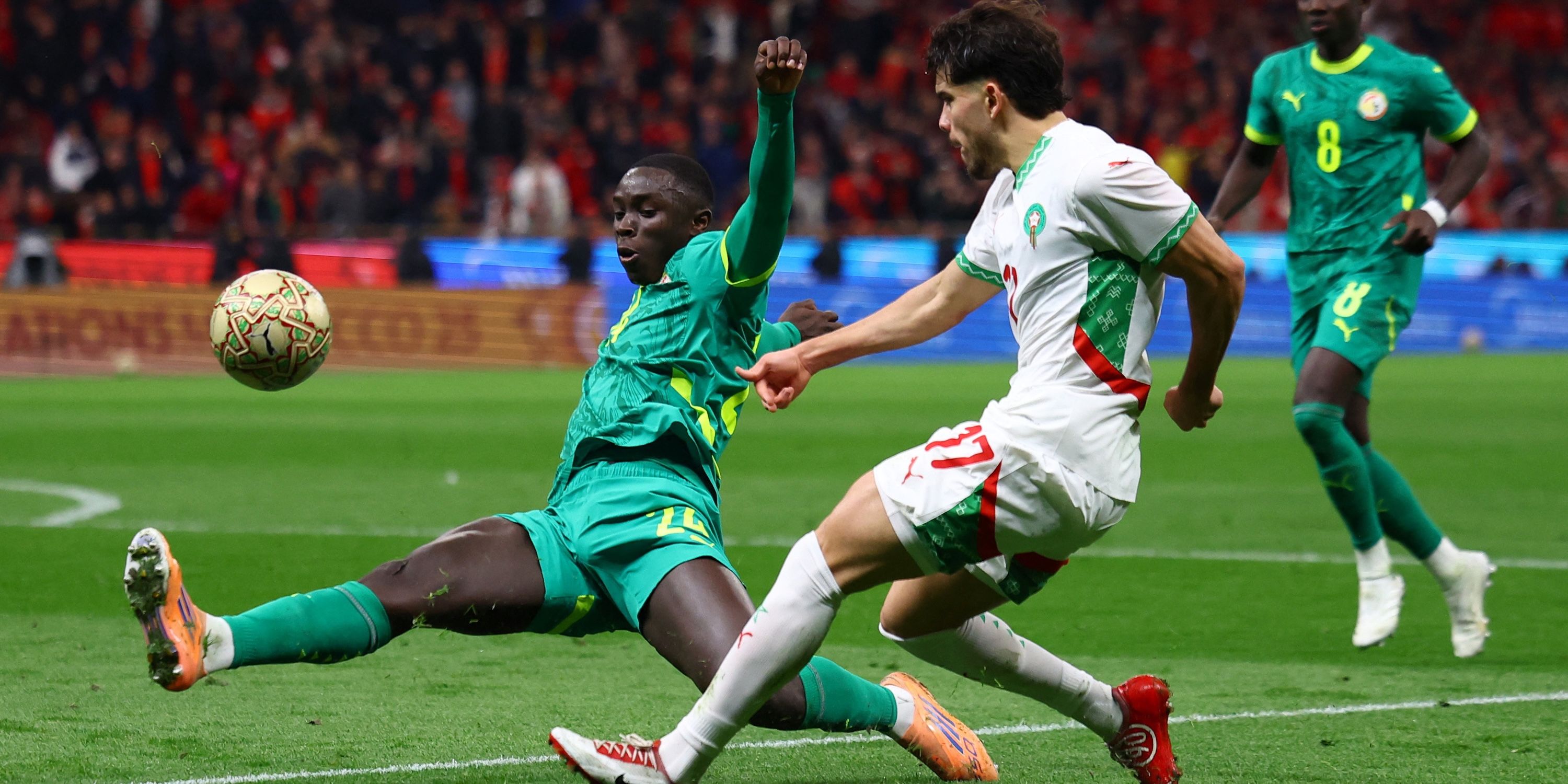 Morocco's Abdou Ezarzoulli and Senegal's Antoine Mendy during the match
