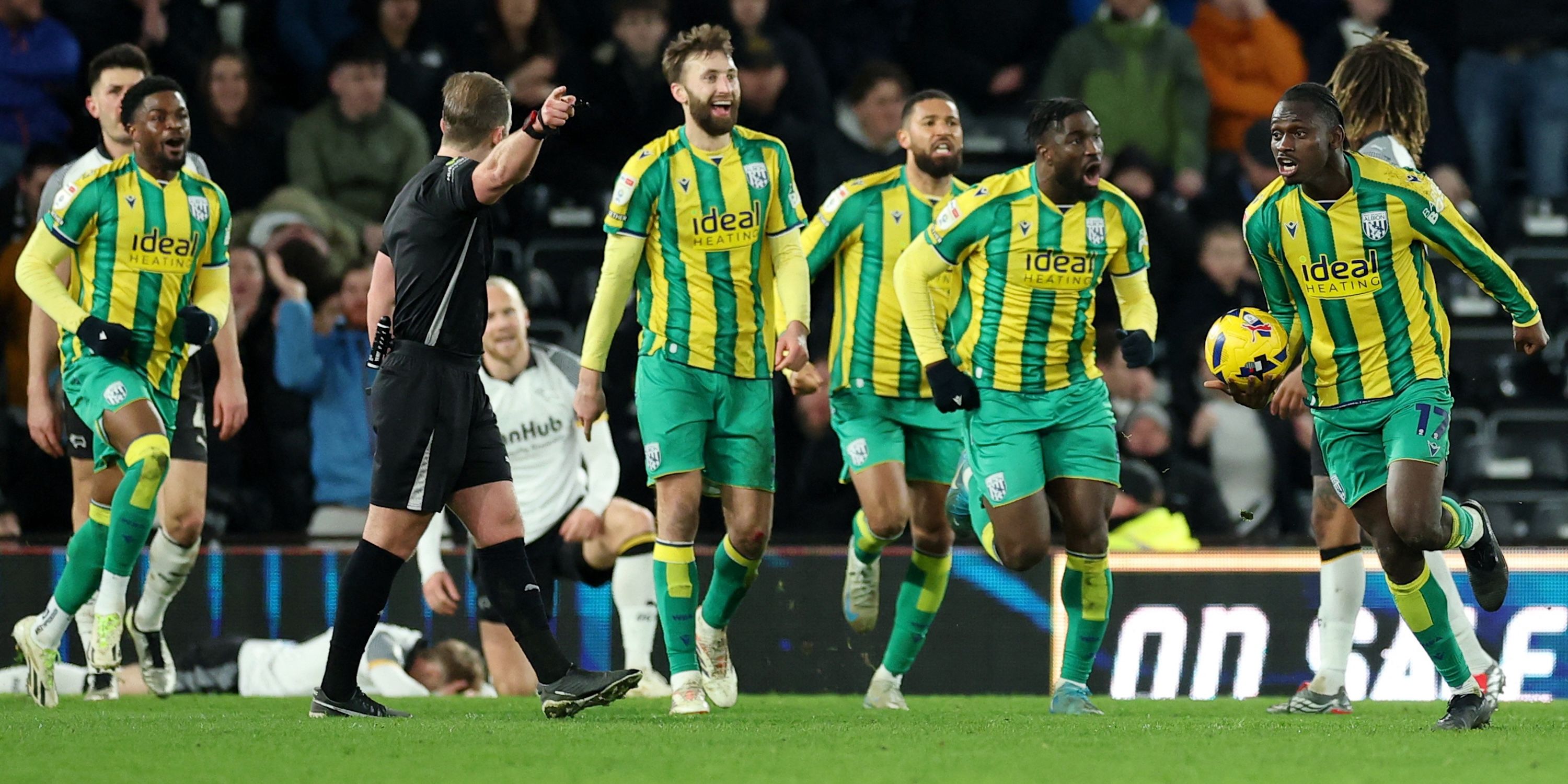 West Bromwich Albion players celebrate after Chris Mepham scores their first goal 