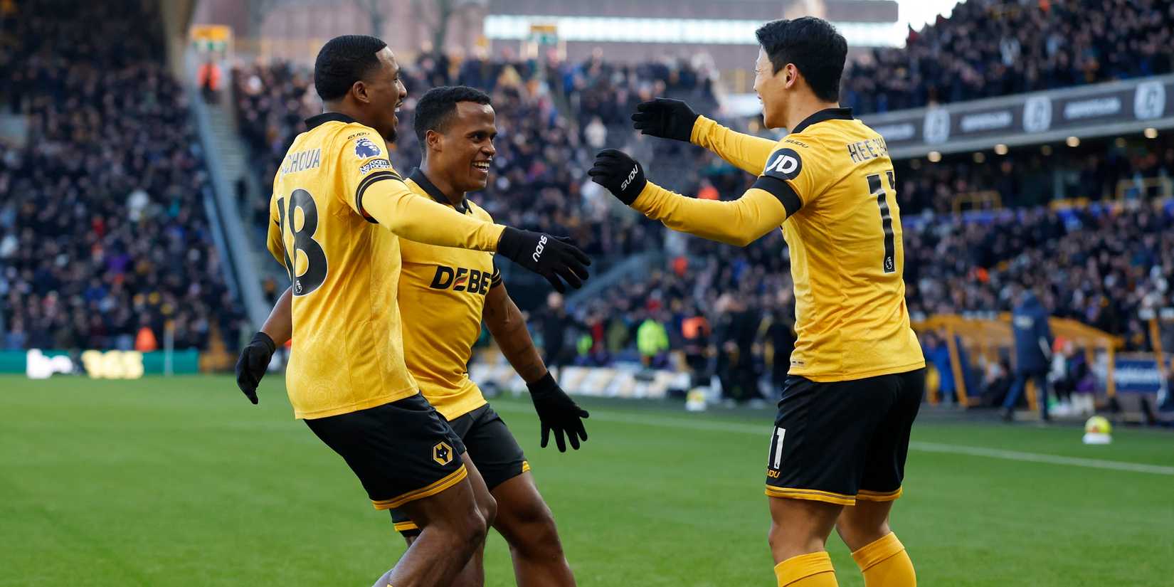 Wolverhampton Wanderers' Jhon Arias celebrates scoring their first goal with Jackson Tchatchoua and Hwang Hee-chan