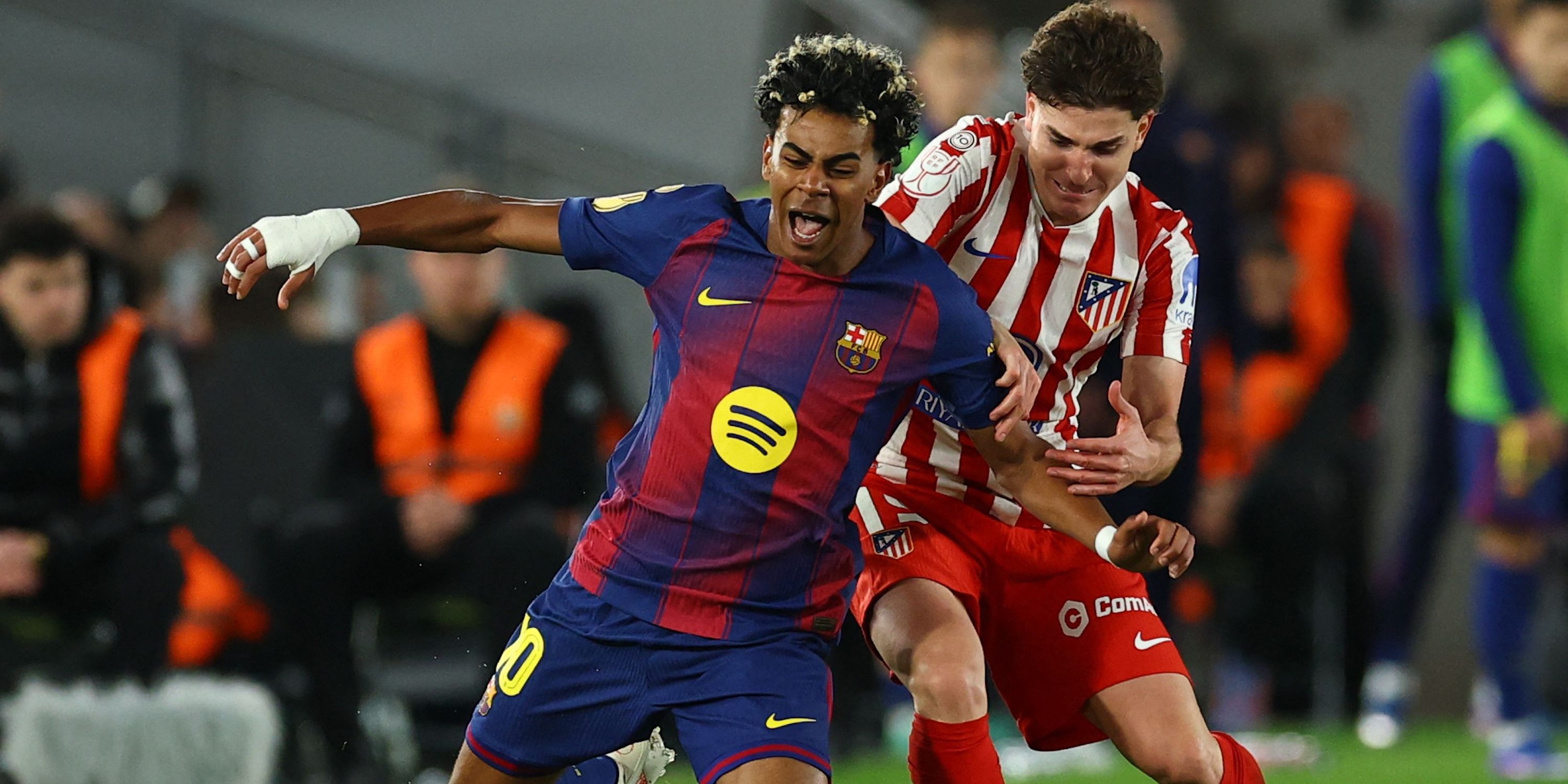 Barcelona's Lamine Yamal in action with Atletico Madrid's Julian Alvarez