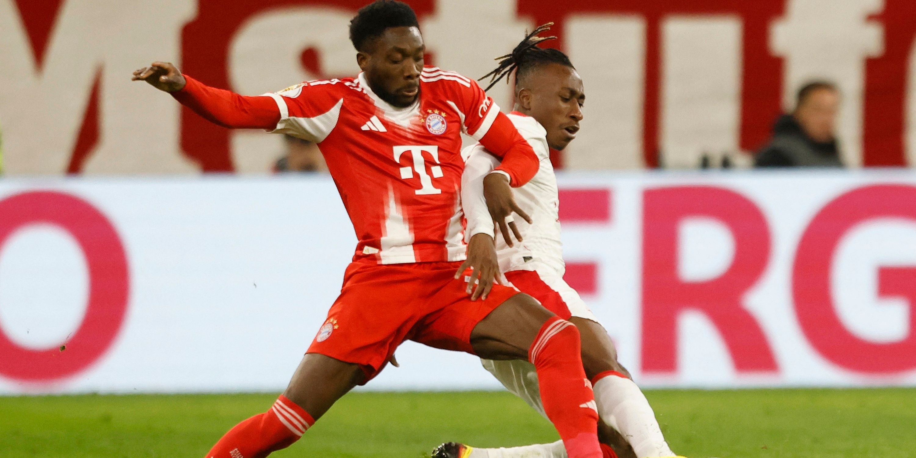 Bayern Munich's Alphonso Davies in action with RB Leipzig's Yan Diomande