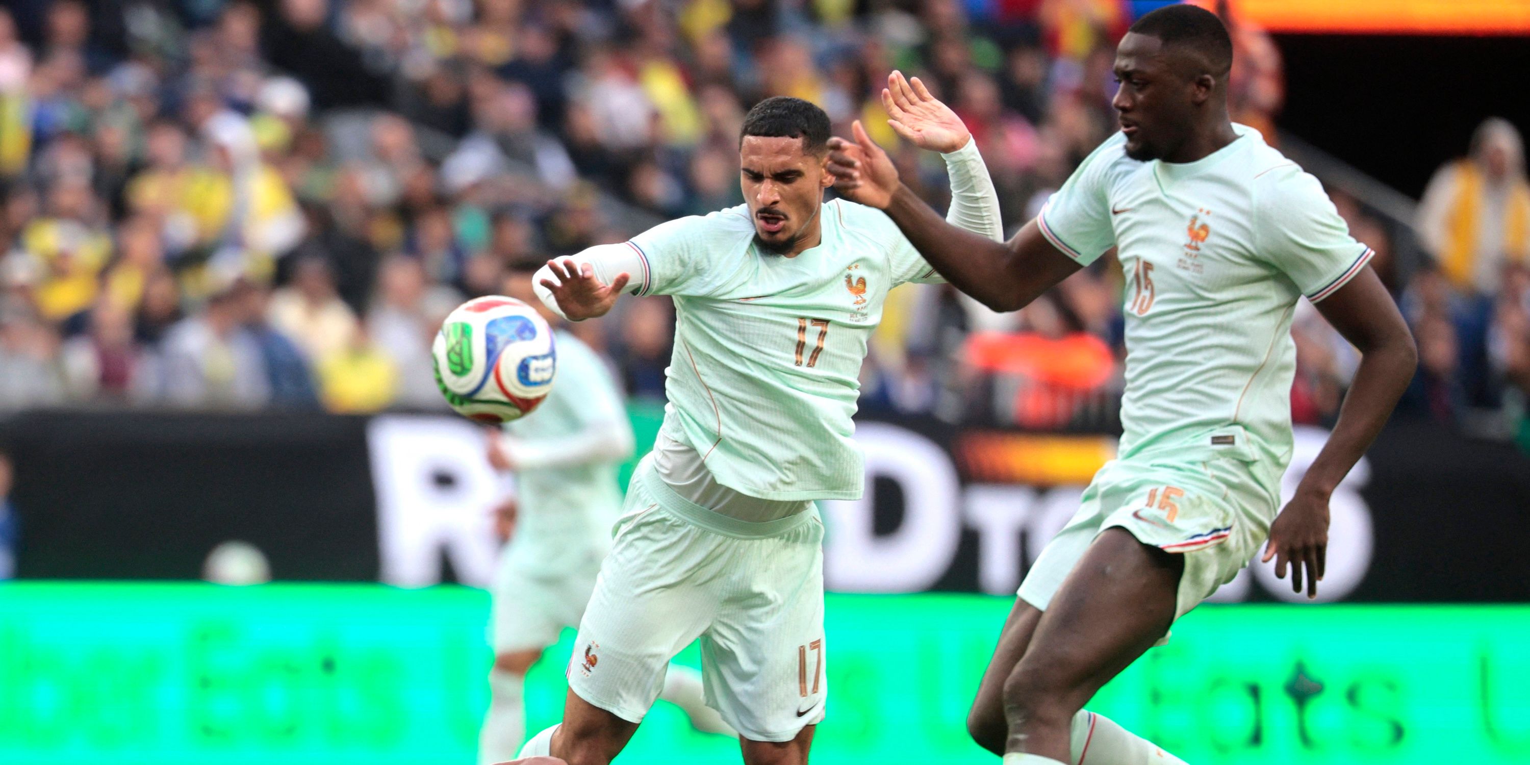Brazil's Igor Thiago in action with France's Maxence Lacroix and Ibrahima Konate