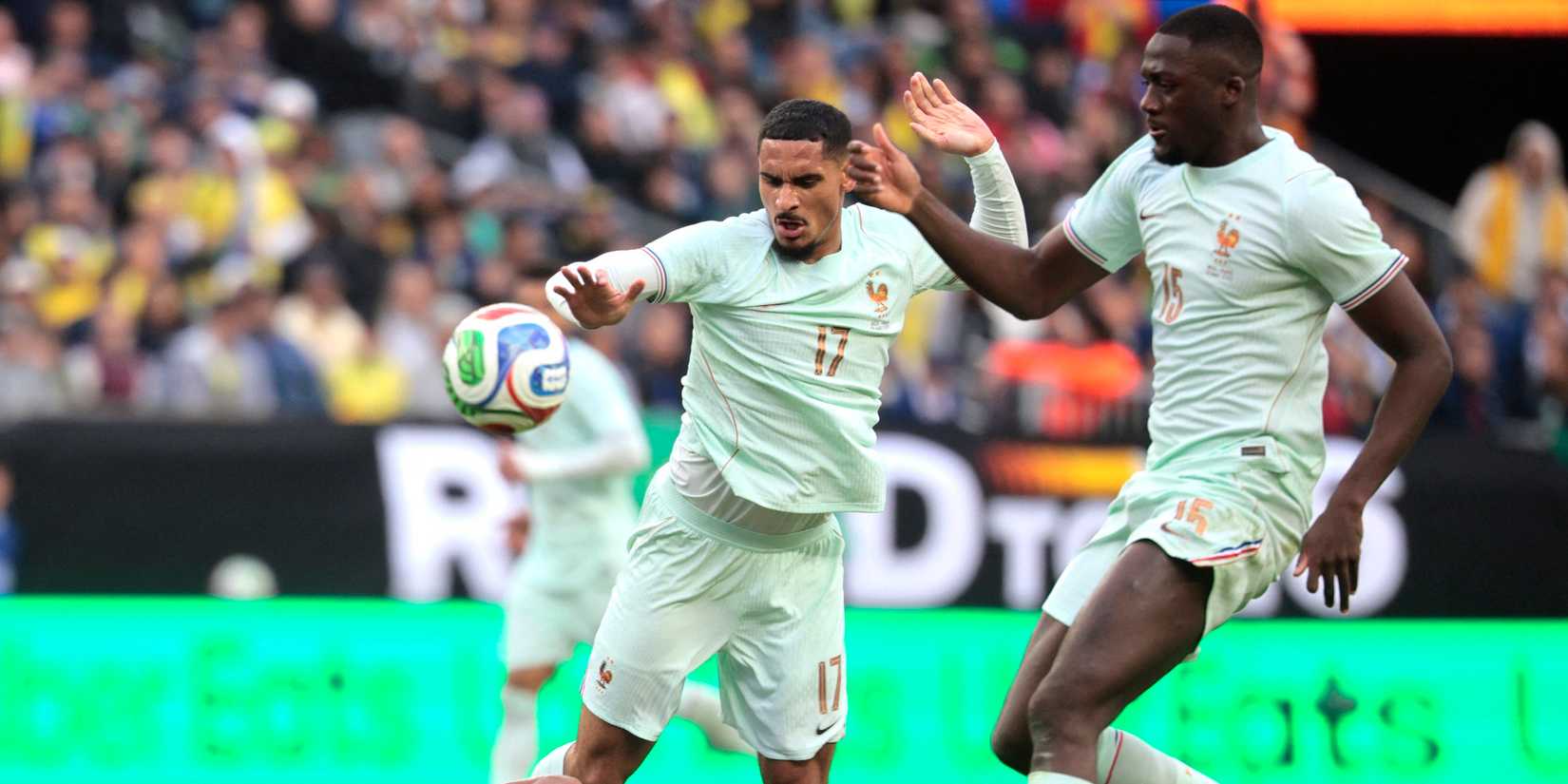 Brazil's Igor Thiago in action with France's Maxence Lacroix and Ibrahima Konate