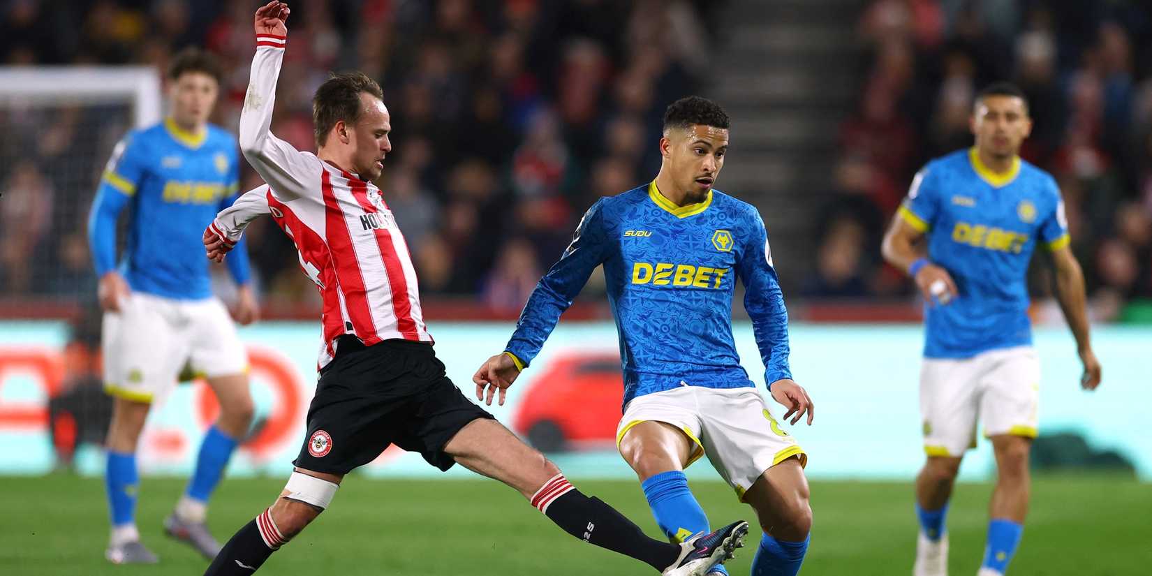 Brentford's Mikkel Damsgaard plays with Wolverhampton Wanderers' Joao Gomes