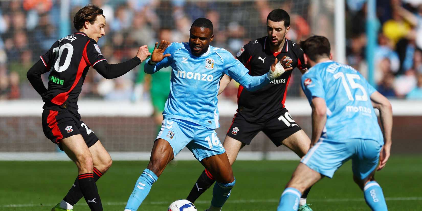 Coventry City's Frank Onyeka in action with Southampton's Caspar Jander and Finn Azaz 