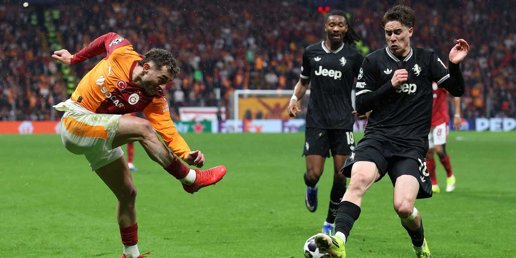 Galatasaray's Baris Alper Yilmaz in action with Juventus' Kenan Yildiz