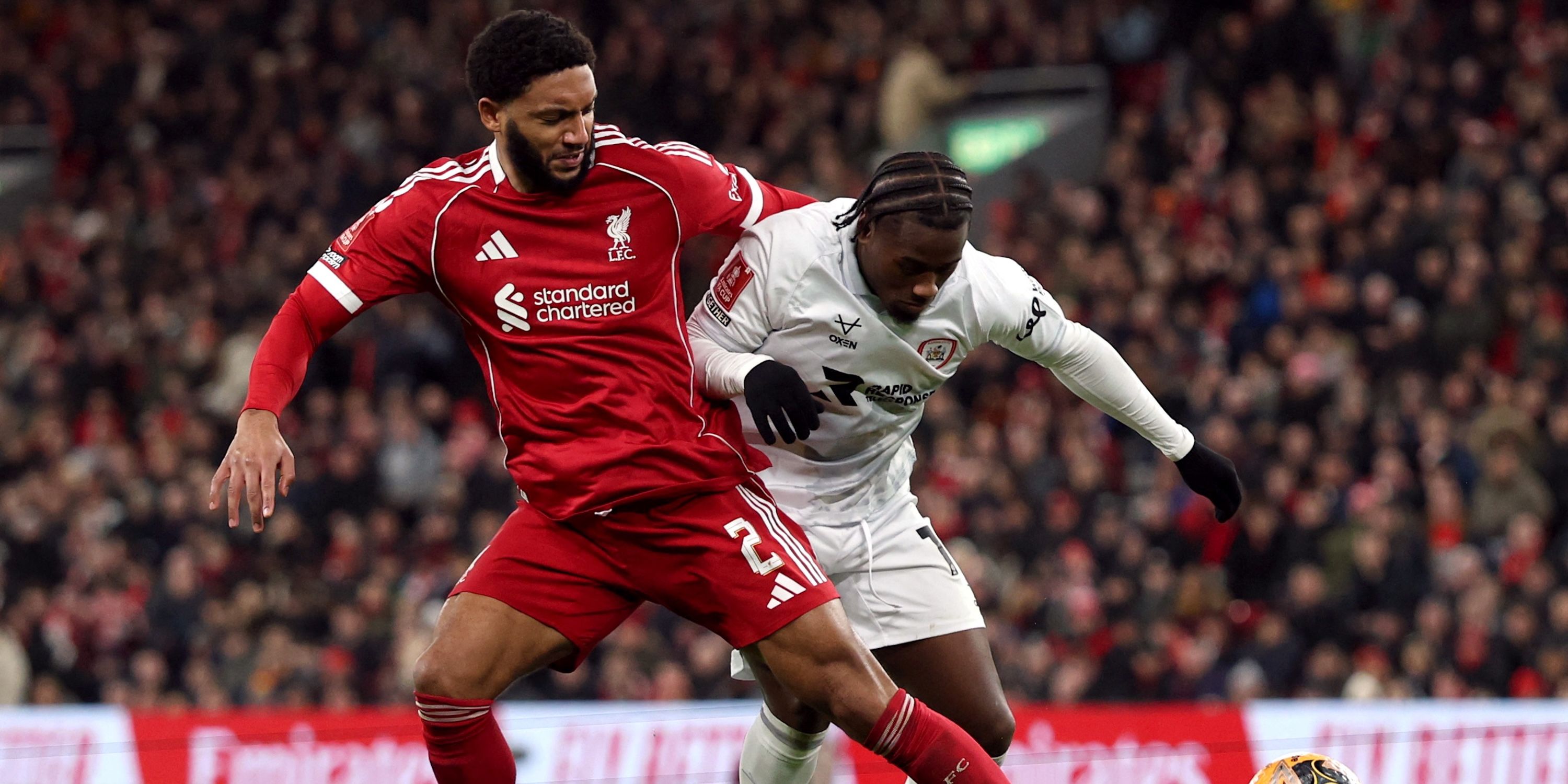 Liverpool's Joe Gomez in action with Barnsley's Reyes Cleary
