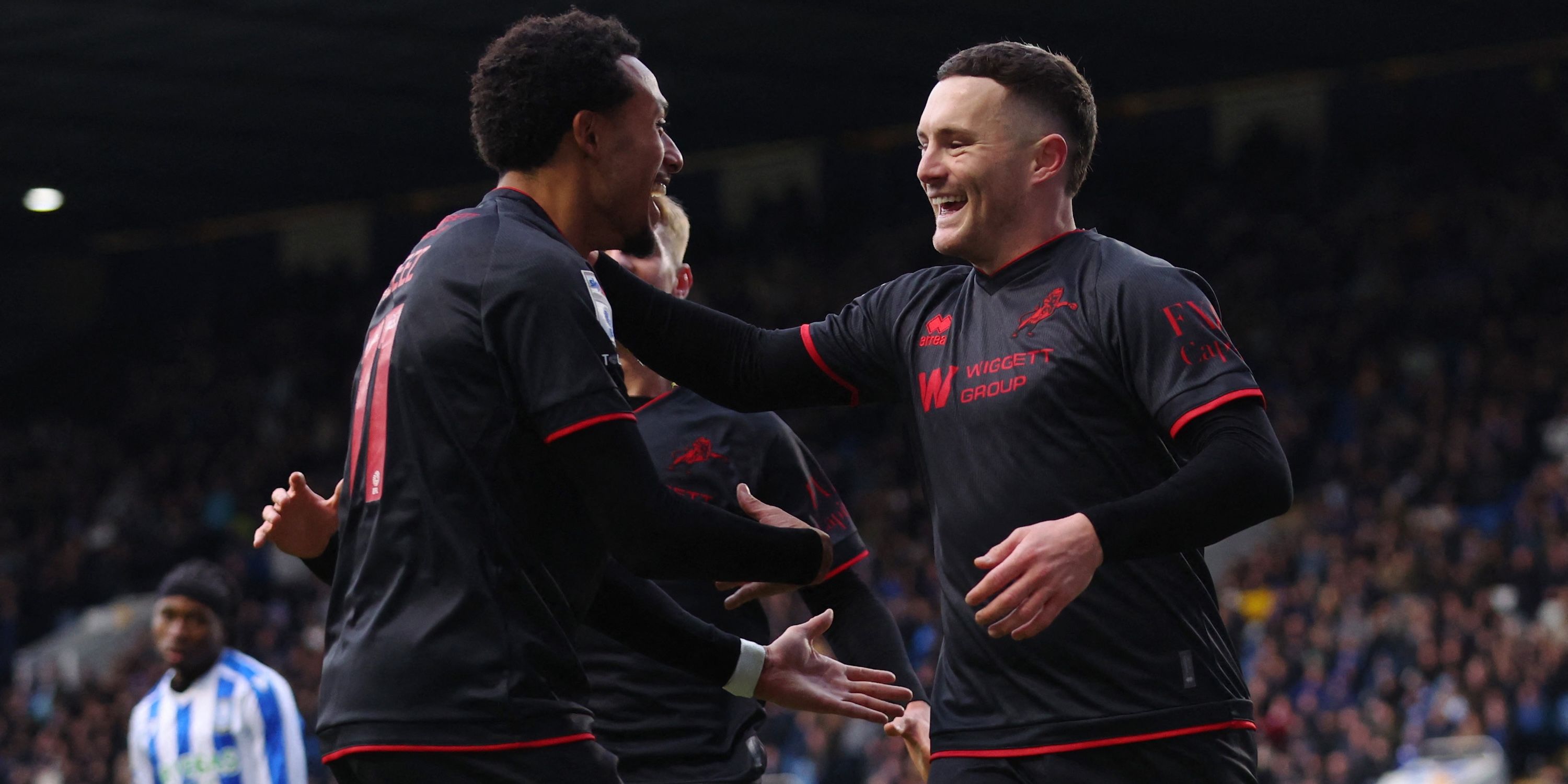 Millwall's Macaulay Langstaff celebrates scoring their second goal with Femi Azeez