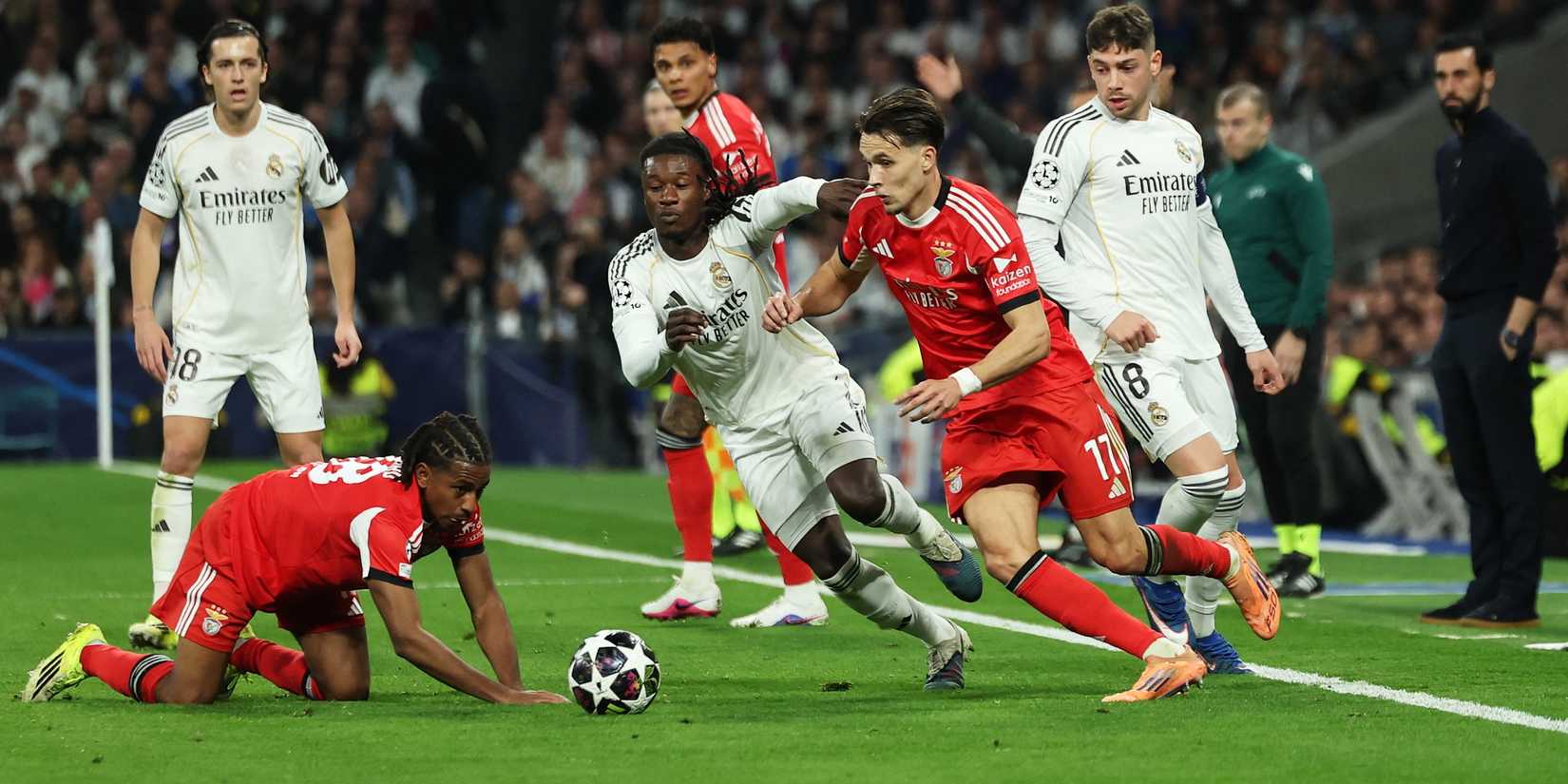 Real Madrid's Federico Valverde and Real Madrid's Eduardo Camavinga in action with Benfica's Amar Dedic and Benfica's Leandro Barreiro