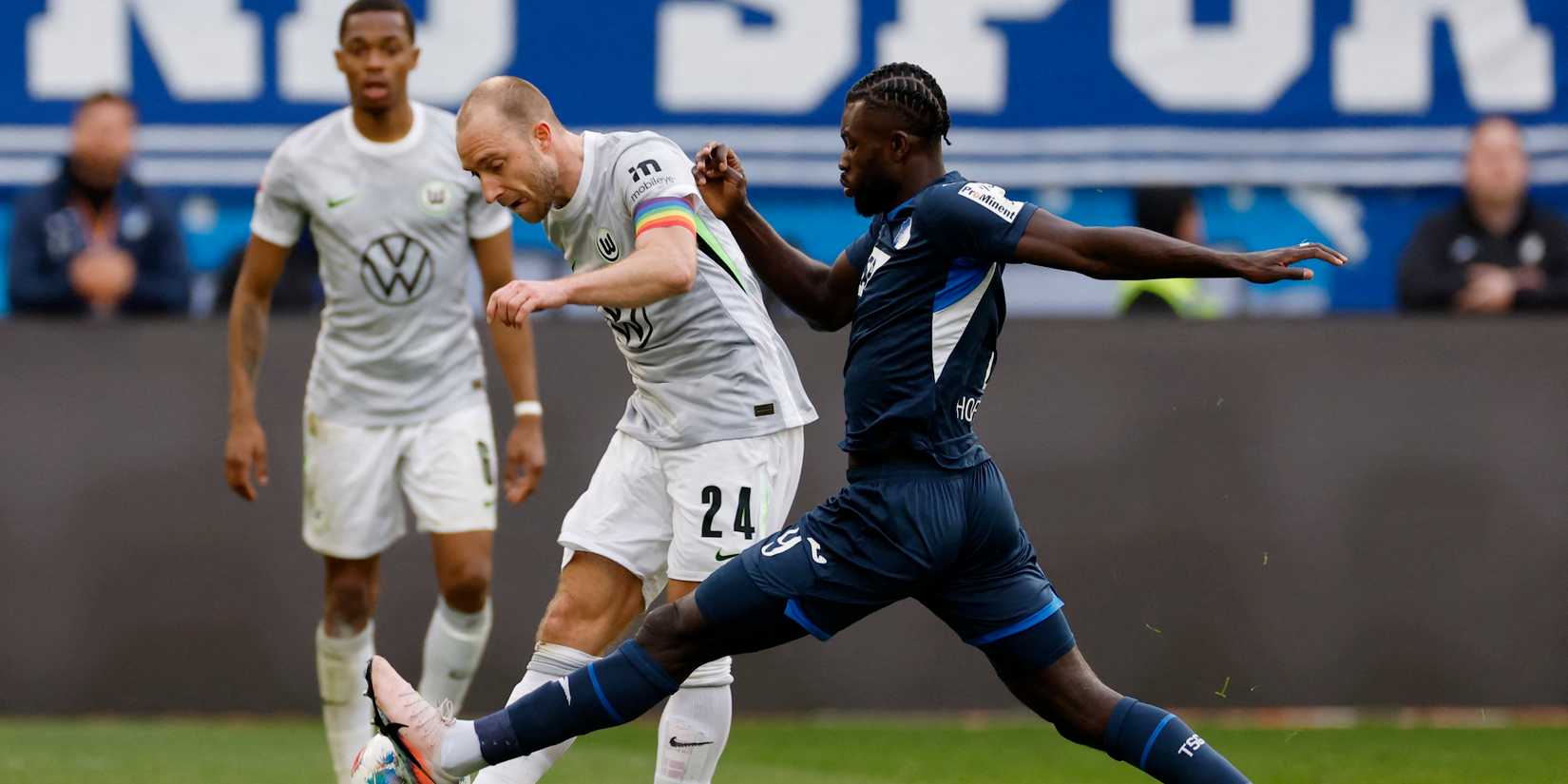 VfL Wolfsburg's Christian Eriksen in action with TSG 1899 Hoffenheim's Bazoumana Toure