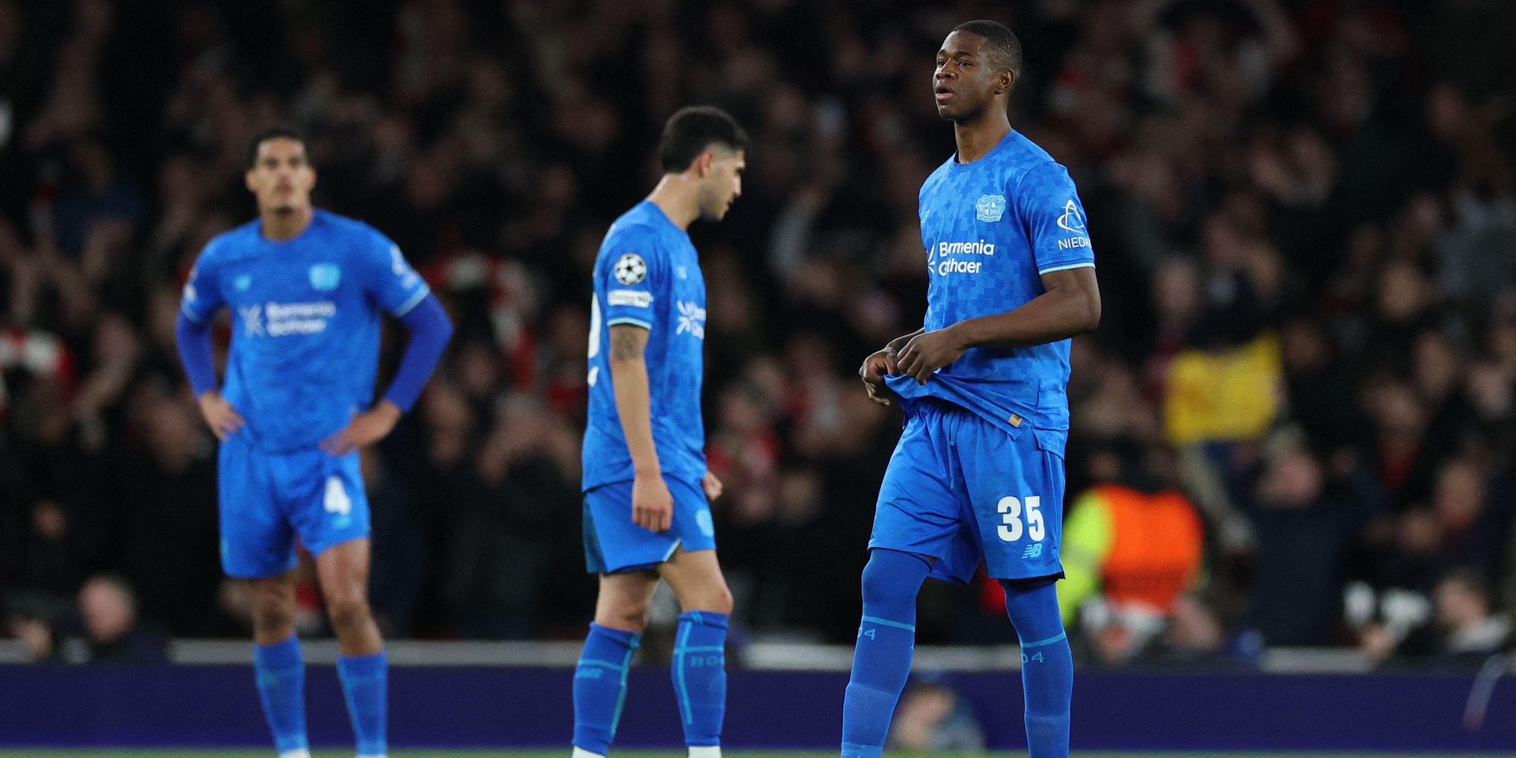 Bayer Leverkusen's Christian Kofane looks dejected after Arsenal's Declan Rice scores their second goal 
