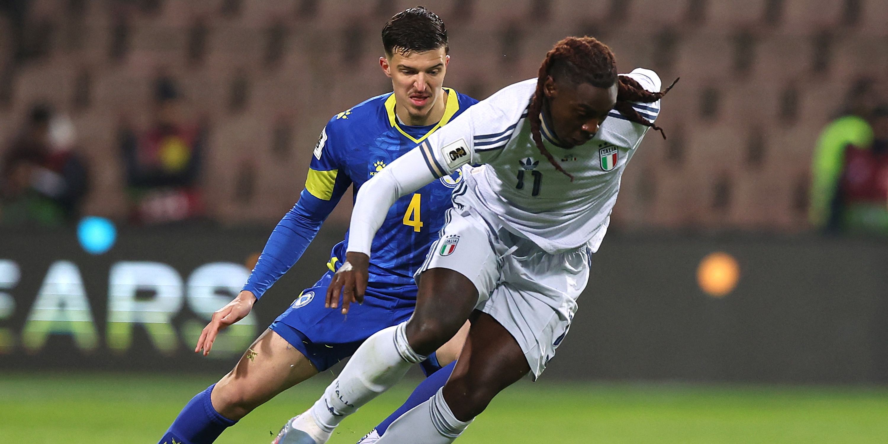  Bosnia and Herzegovina's Tarik Muharemovic in action with Italy's Moise Kean