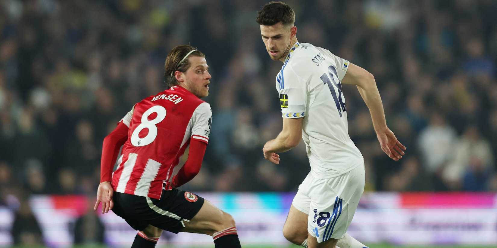 Brentford's Mathias Jensen in action with Leeds United's Anton Stach 