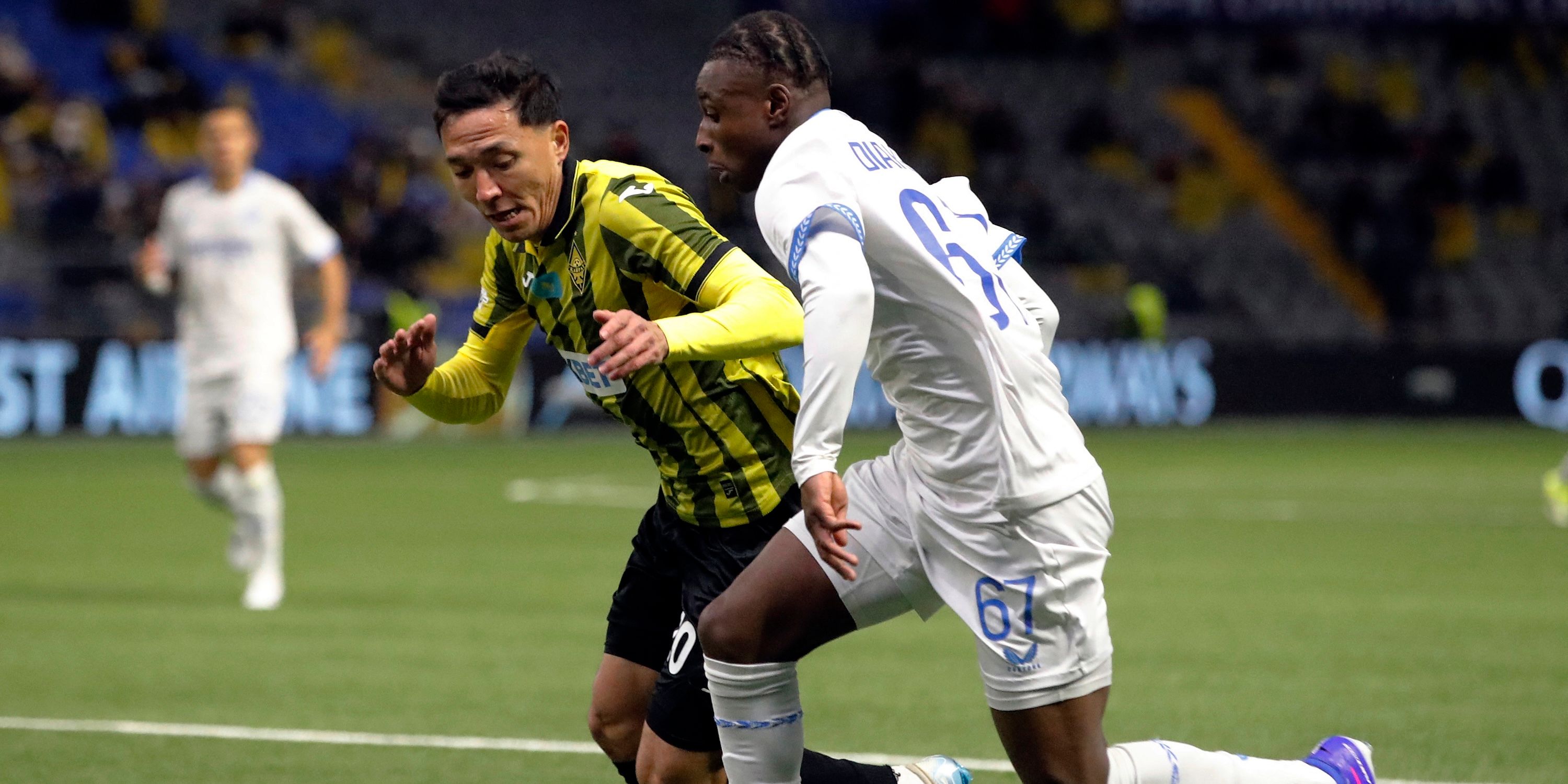 Club Brugge's Mamadou Diakhon in action with Kairat's Yerkin Tapalov