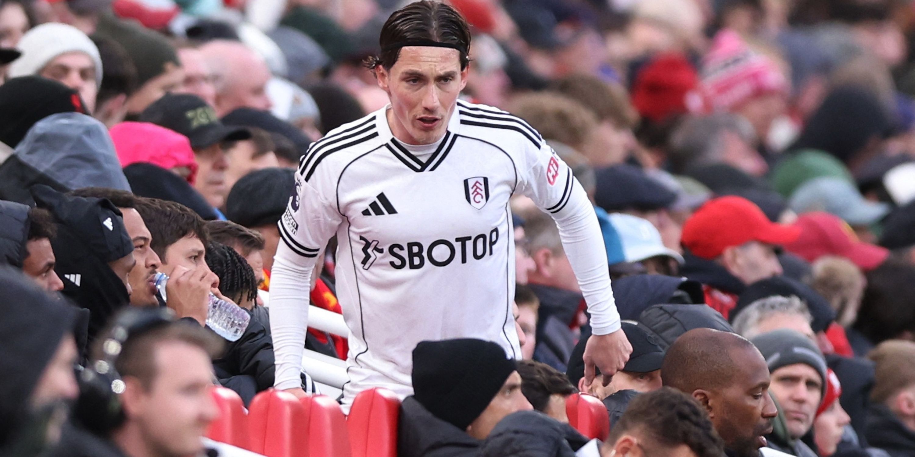 Fulham's Harry Wilson reacts on the bench after he is substituted