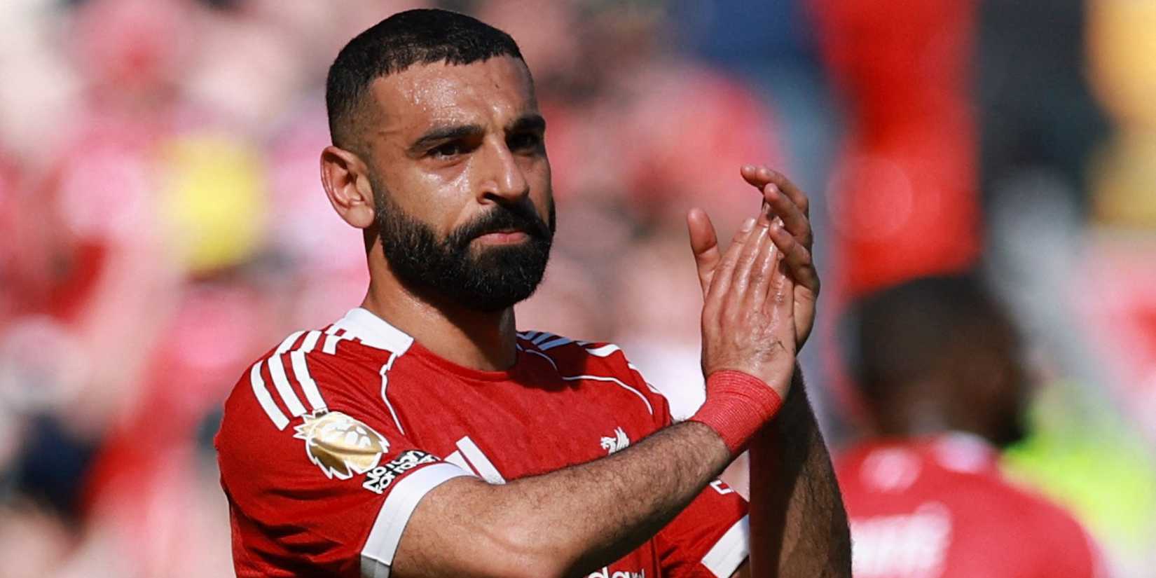  Liverpool's Mohamed Salah applauds fans as he walks off the pitch